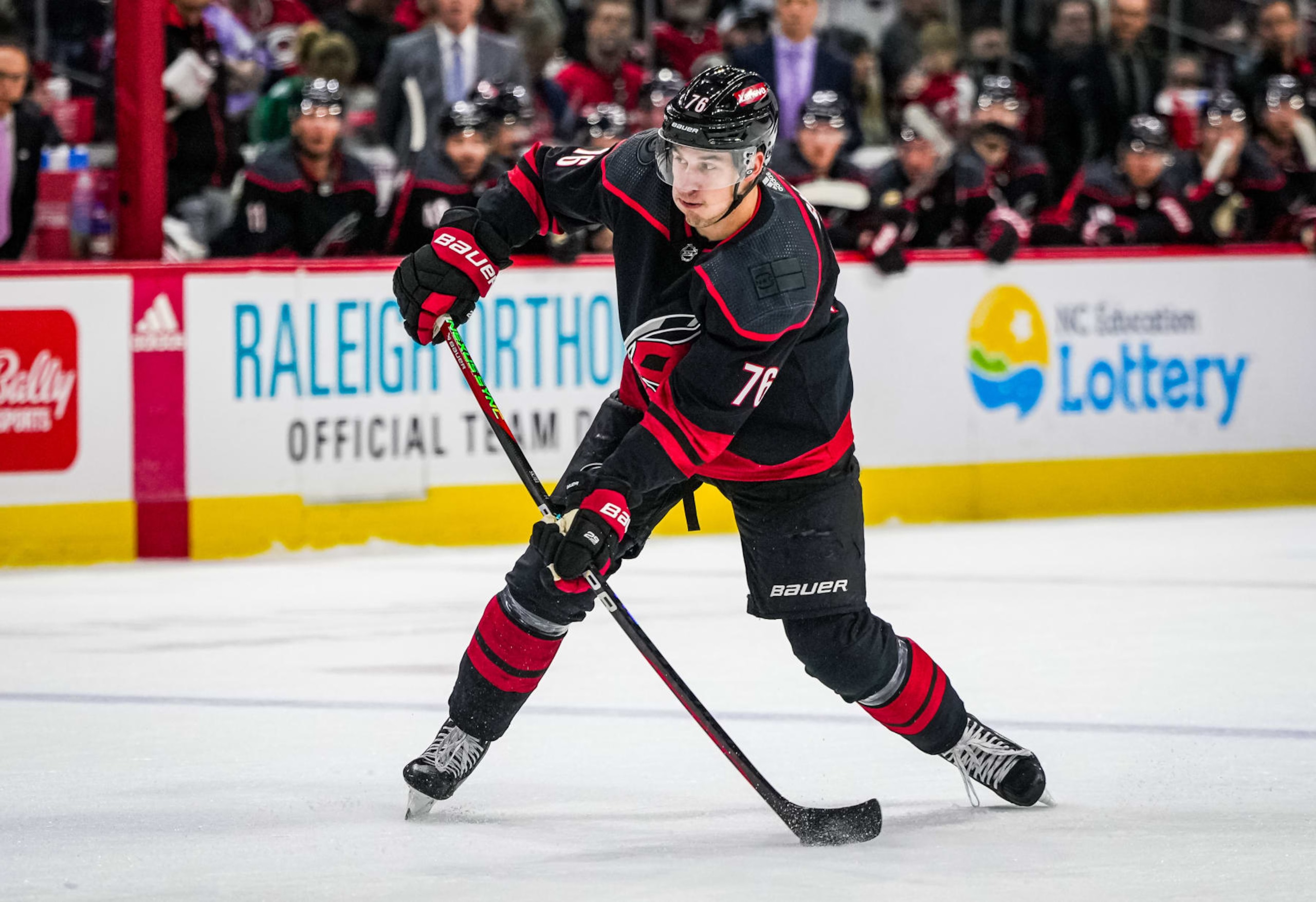 RALEIGH, NORTH CAROLINA - NOVEMBER 30: Brady Skjei #76 of the Carolina Hurricanes shoots the puck during the first period against the New York Islanders at PNC Arena on November 30, 2023 in Raleigh, North Carolina. (Photo by Josh Lavallee/NHLI via Getty Images)