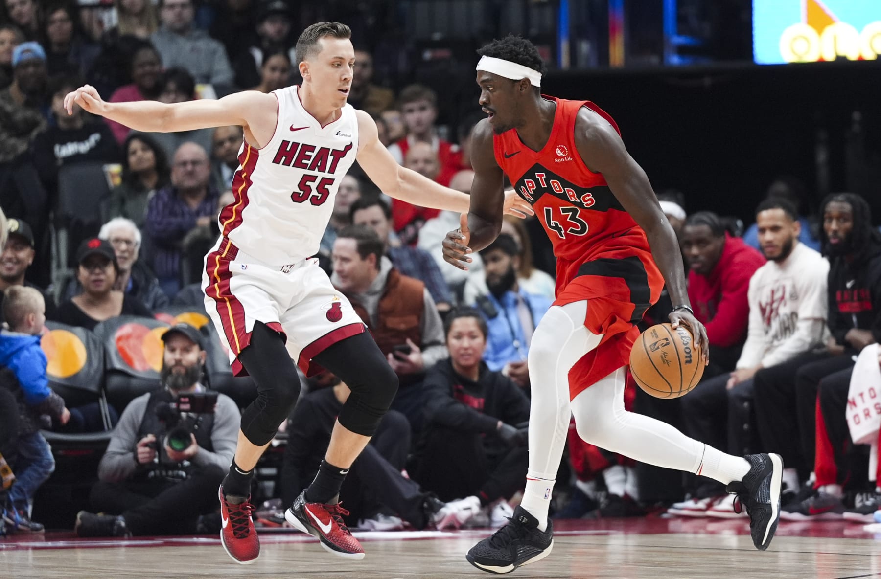 TORONTO, ON - DECEMBER 6: Pascal Siakam #43 of the Toronto Raptors is guarded by Duncan Robinson #55 of the Miami Heat during the first half of their basketball game at the Scotiabank Arena on December 6, 2023 in Toronto, Ontario, Canada. NOTE TO USER: User expressly acknowledges and agrees that, by downloading and/or using this Photograph, user is consenting to the terms and conditions of the Getty Images License Agreement. (Photo by Mark Blinch/Getty Images)
