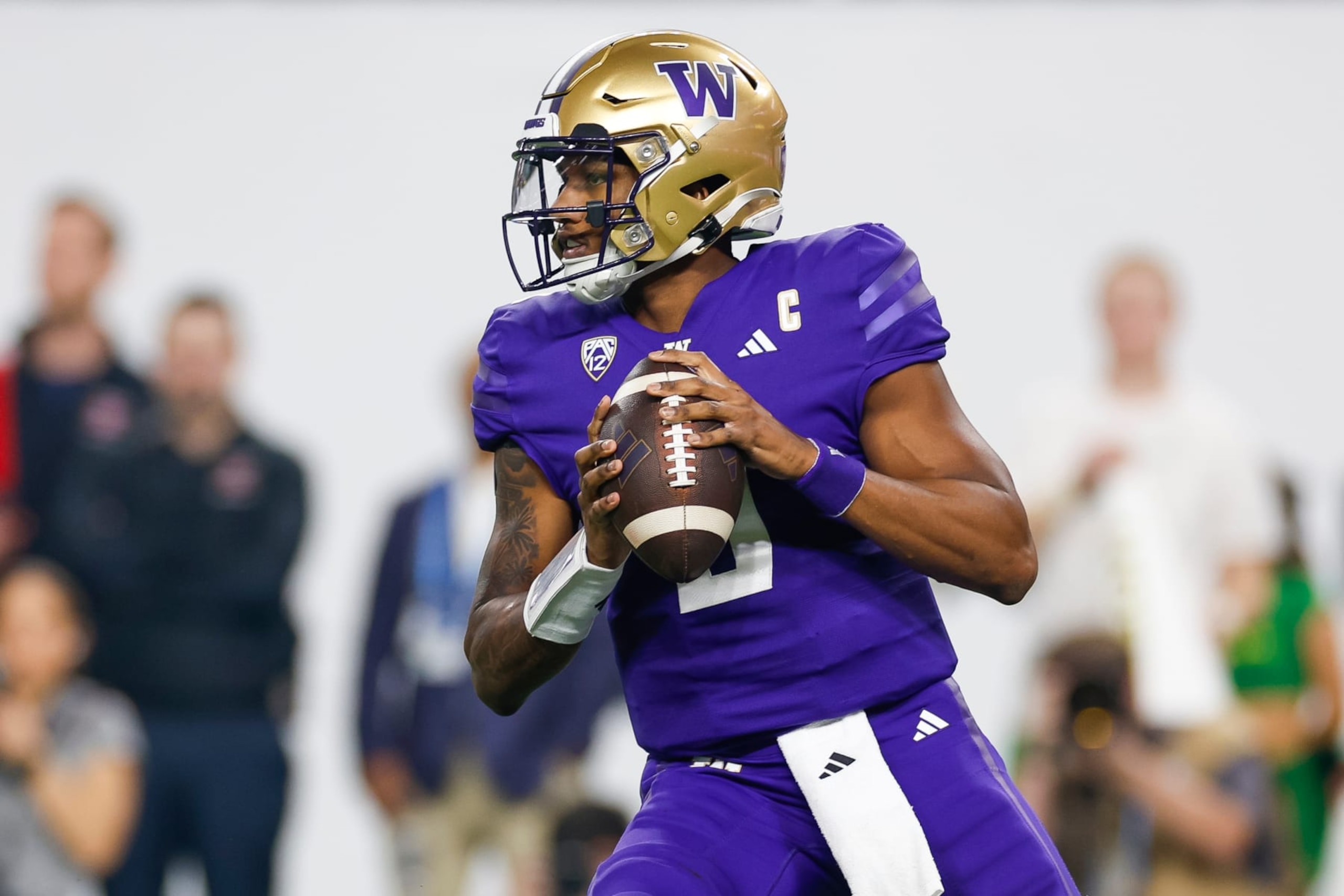 LAS VEGAS, NEVADA - DECEMBER 1: Michael Penix Jr. #9 of the Washington Huskies looks for an open receiver during the Pac-12 Championship game against the Oregon Ducks at Allegiant Stadium on December 1, 2023 in Las Vegas, Nevada. (Photo by Brandon Sloter/Image Of Sport/Getty Images)