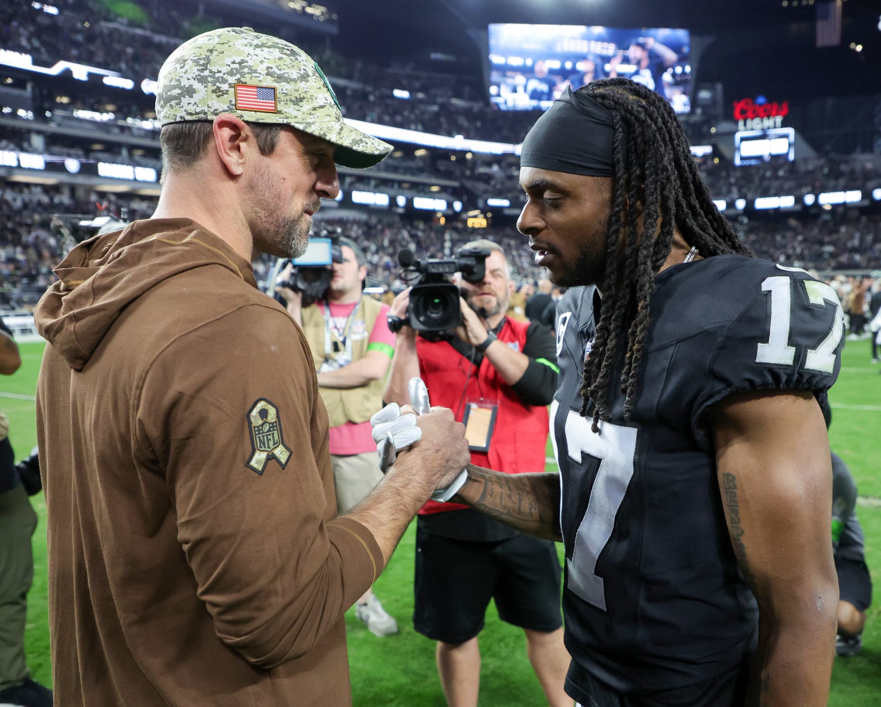 LAS VEGAS, NEVADA - NOVEMBER 12: Quarterback Aaron Rodgers #8 of the New York Jets and wide receiver Davante Adams #17 of the Las Vegas Raiders visit on the field after the Raiders' 16-12 victory over the Jets at Allegiant Stadium on November 12, 2023 in Las Vegas, Nevada. (Photo by Ethan Miller/Getty Images)