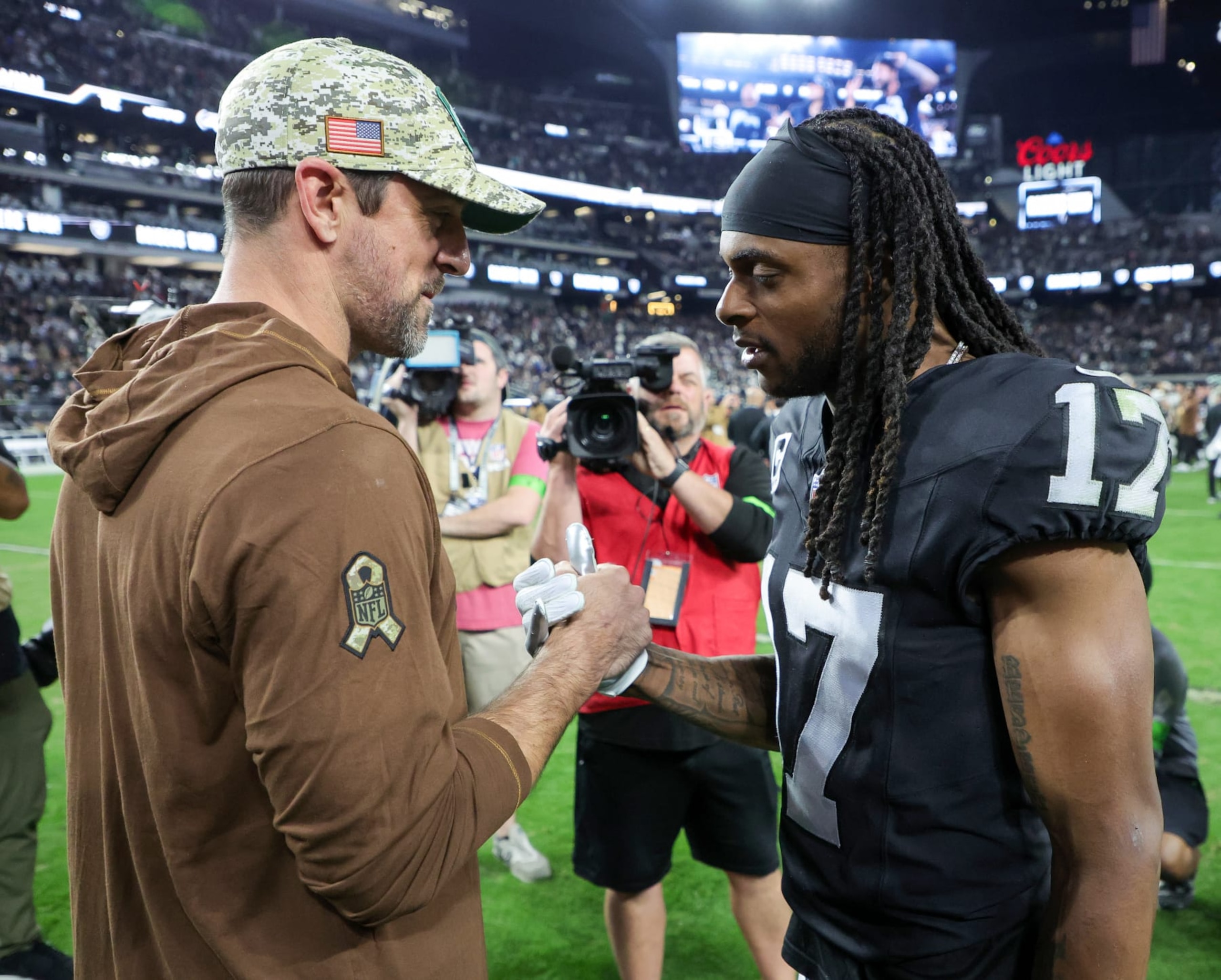 LAS VEGAS, NEVADA - NOVEMBER 12: Quarterback Aaron Rodgers #8 of the New York Jets and wide receiver Davante Adams #17 of the Las Vegas Raiders visit on the field after the Raiders' 16-12 victory over the Jets at Allegiant Stadium on November 12, 2023 in Las Vegas, Nevada. (Photo by Ethan Miller/Getty Images)