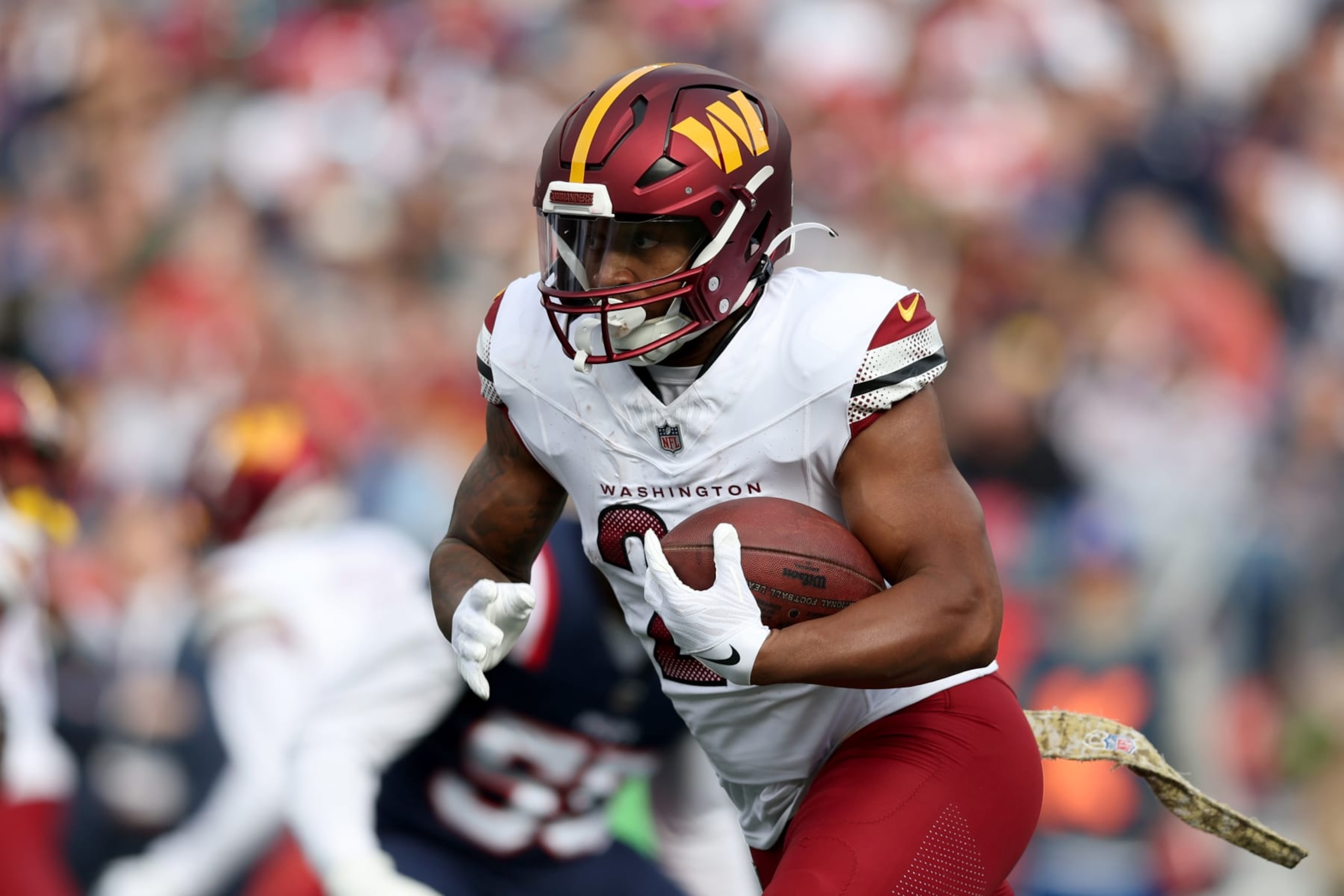 FOXBOROUGH, MASSACHUSETTS - NOVEMBER 05: Antonio Gibson #24 of the Washington Commanders runs the ball during the first half in the game against the New England Patriots at Gillette Stadium on November 05, 2023 in Foxborough, Massachusetts. (Photo by Adam Glanzman/Getty Images)