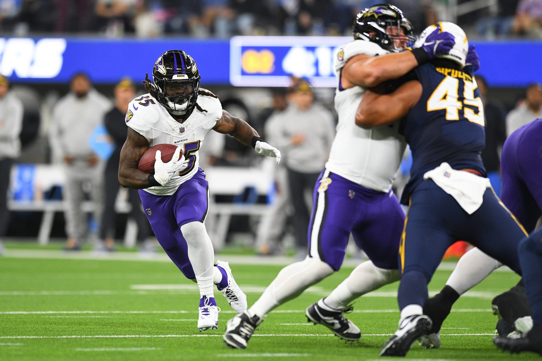 INGLEWOOD, CA - NOVEMBER 26: Baltimore Ravens running back Gus Edwards (35) runs up field during the NFL regular season game between the Baltimore Ravens and the Los Angeles Chargers on November 26, 2023, at SoFi Stadium in Inglewood, CA. (Photo by Brian Rothmuller/Icon Sportswire via Getty Images)