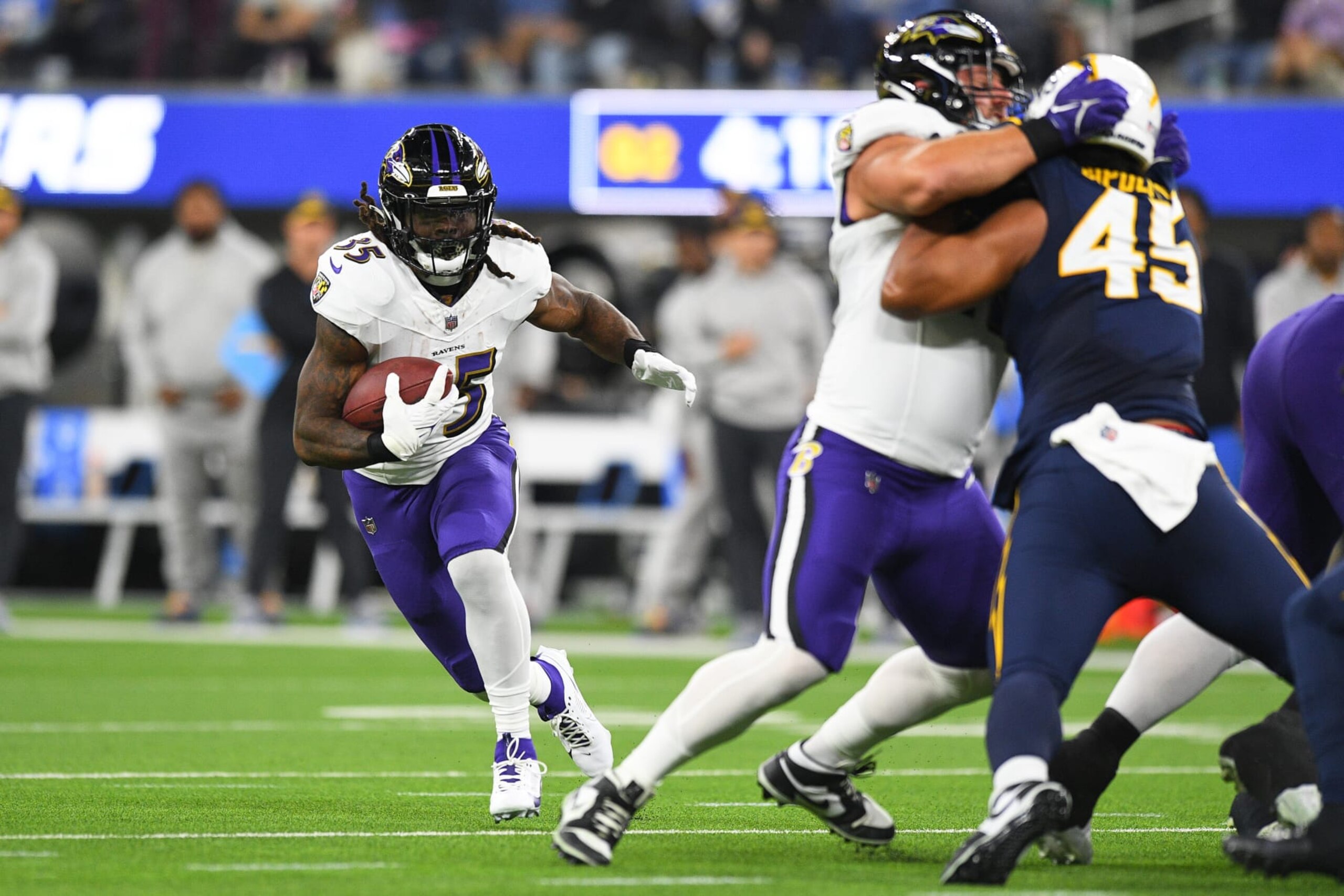 INGLEWOOD, CA - NOVEMBER 26: Baltimore Ravens running back Gus Edwards (35) runs up field during the NFL regular season game between the Baltimore Ravens and the Los Angeles Chargers on November 26, 2023, at SoFi Stadium in Inglewood, CA. (Photo by Brian Rothmuller/Icon Sportswire via Getty Images)