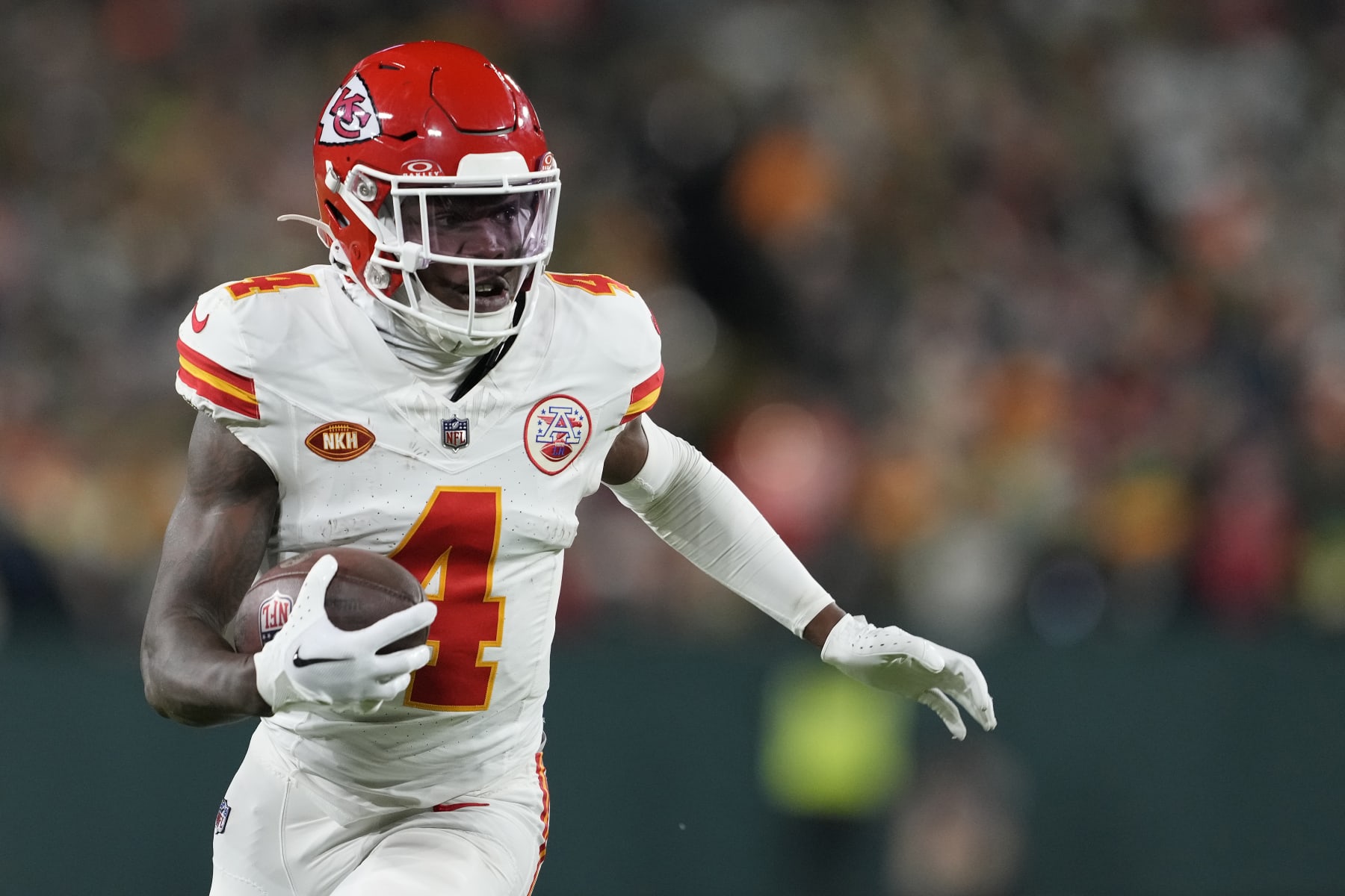 GREEN BAY, WISCONSIN - DECEMBER 03: Rashee Rice #4 of the Kansas City Chiefs runs with the ball in the second half against the Green Bay Packers at Lambeau Field on December 03, 2023 in Green Bay, Wisconsin. (Photo by Patrick McDermott/Getty Images)