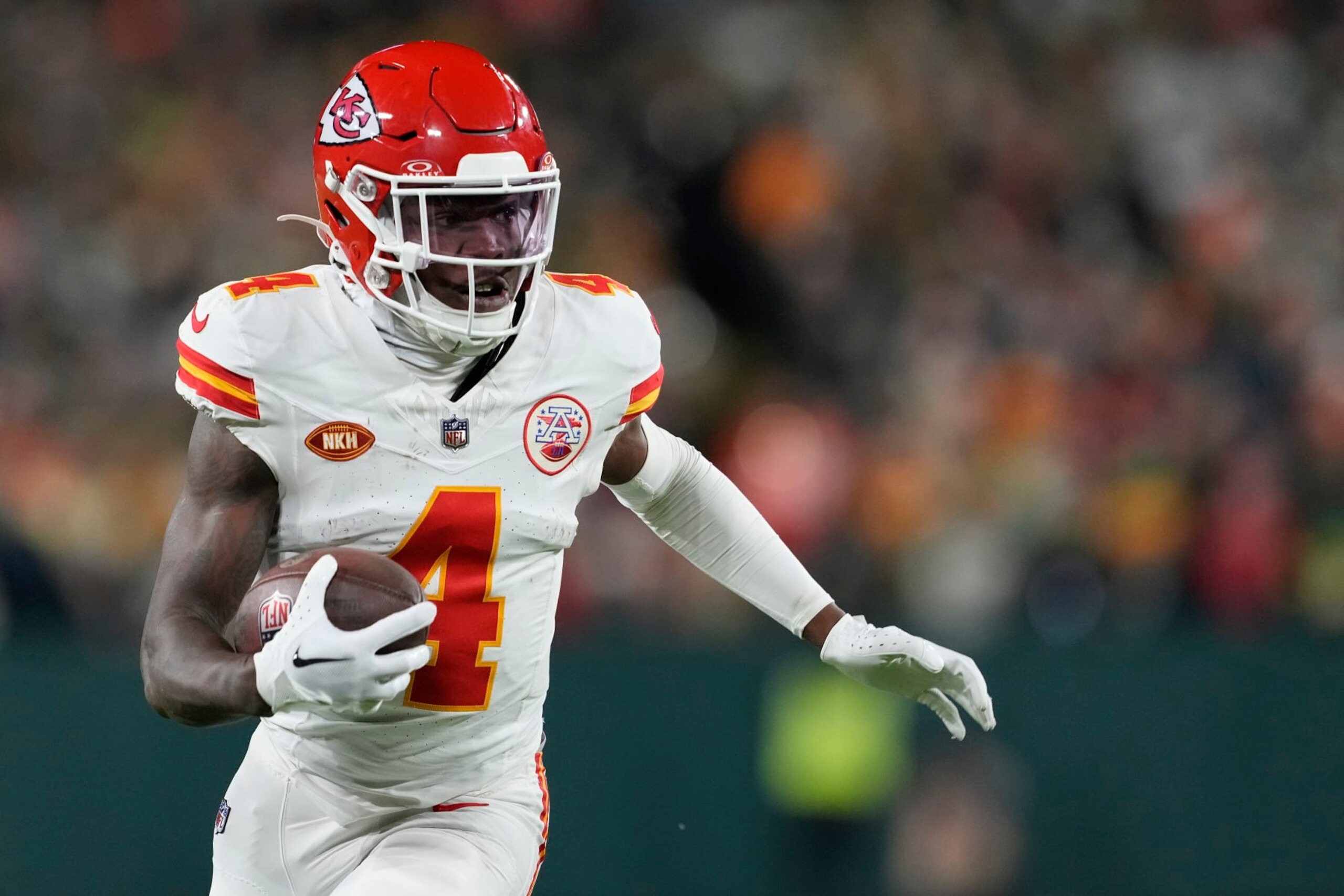 GREEN BAY, WISCONSIN - DECEMBER 03: Rashee Rice #4 of the Kansas City Chiefs runs with the ball in the second half against the Green Bay Packers at Lambeau Field on December 03, 2023 in Green Bay, Wisconsin. (Photo by Patrick McDermott/Getty Images)