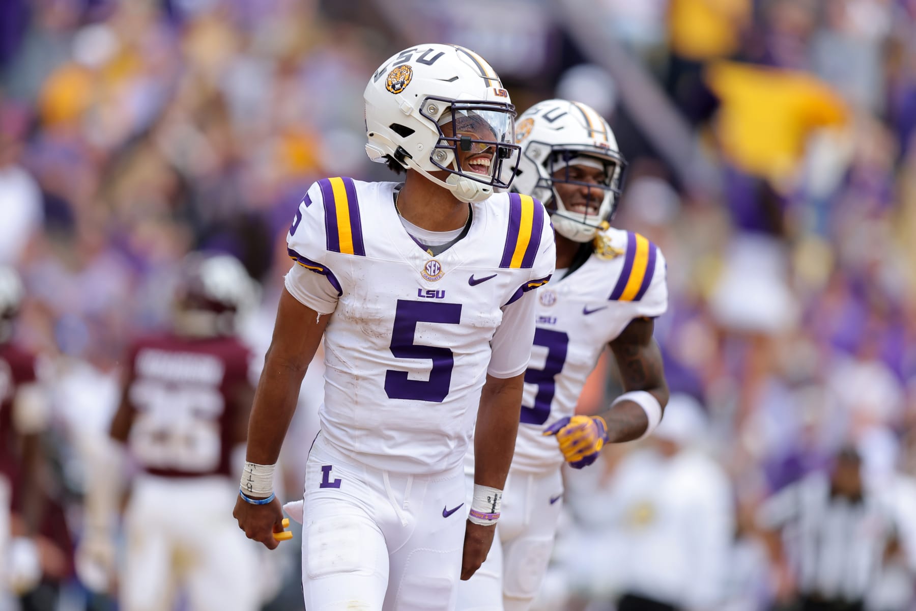 BATON ROUGE, LOUISIANA - NOVEMBER 25: Jayden Daniels #5 of the LSU Tigers celebrates a touchdown during a game against the Texas A&M Aggies at Tiger Stadium on November 25, 2023 in Baton Rouge, Louisiana. (Photo by Jonathan Bachman/Getty Images)
