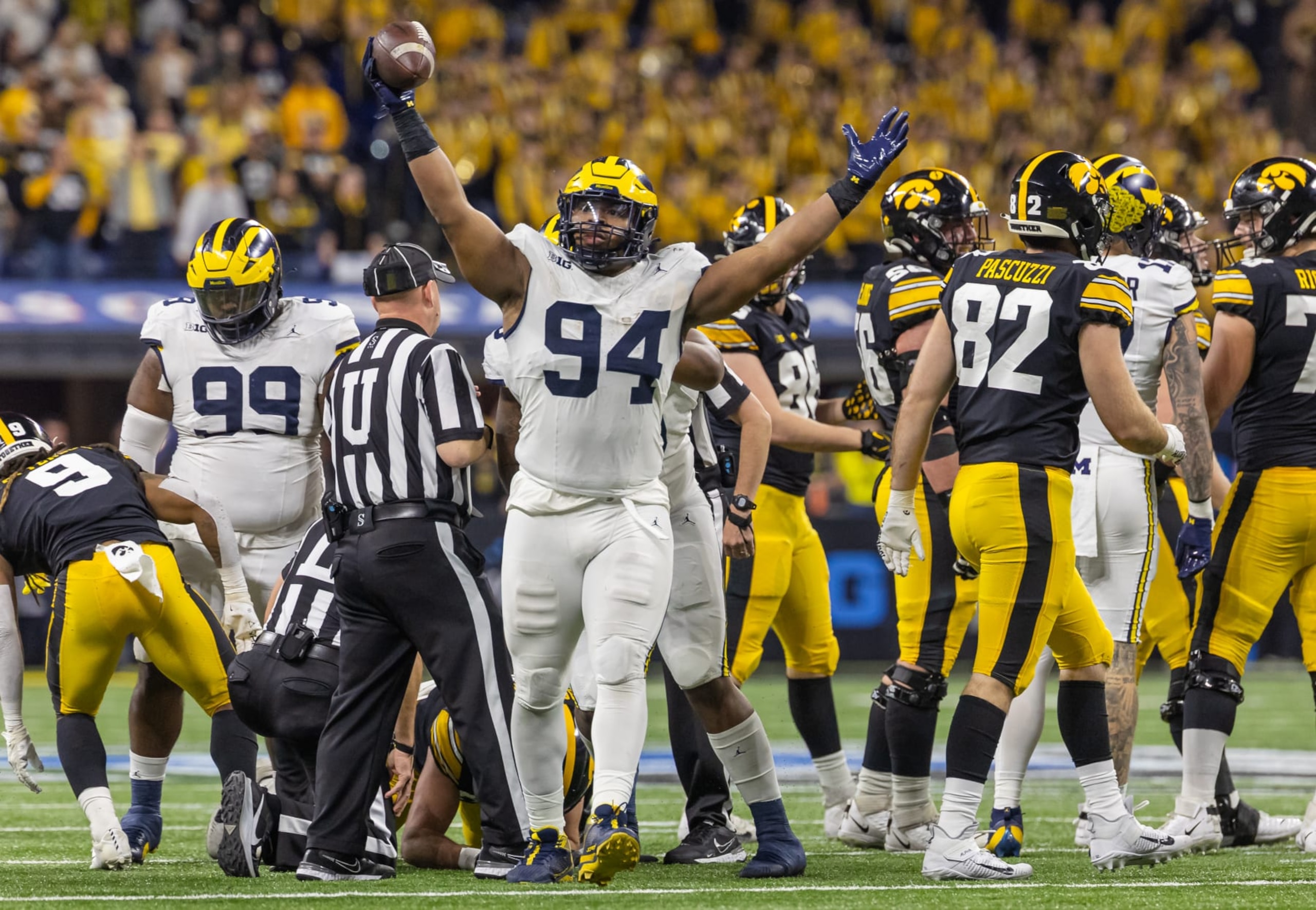 INDIANAPOLIS, INDIANA - DECEMBER 2: Kris Jenkins #94 of the Michigan Wolverines celebrates a turnover  during the Big Ten Championship against the Iowa Hawkeyes at Lucas Oil Stadium on December 2, 2023 in Indianapolis, Indiana. (Photo by Michael Hickey/Getty Images)
