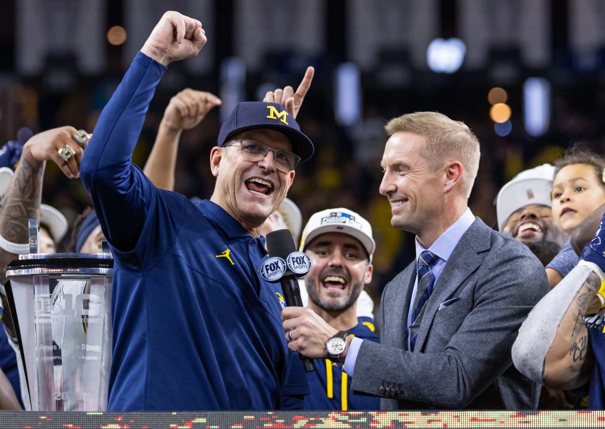 INDIANAPOLIS, INDIANA - DECEMBER 2: Head coach Jim Harbaugh of the Michigan Wolverines celebrates after winning the Big Ten Championship against the Iowa Hawkeyes at Lucas Oil Stadium on December 2, 2023 in Indianapolis, Indiana. (Photo by Michael Hickey/Getty Images)