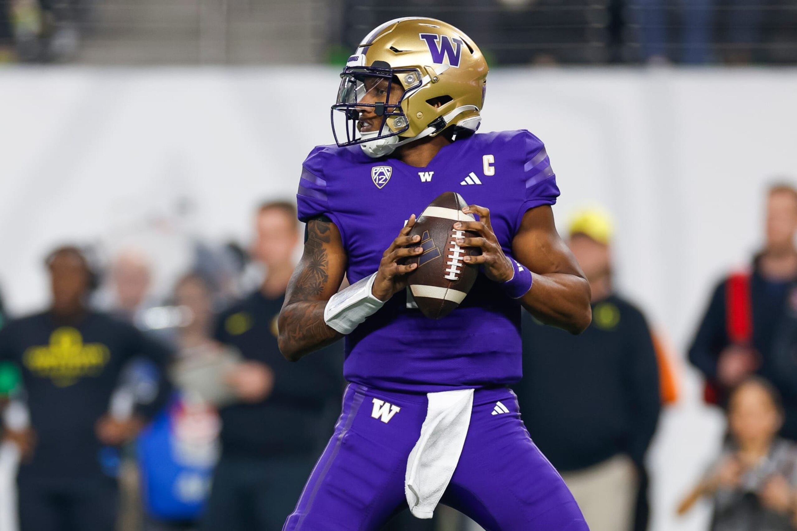 LAS VEGAS, NEVADA - DECEMBER 1: Michael Penix Jr. #9 of the Washington Huskies looks for an open receiver during the Pac-12 Championship game against the Oregon Ducks at Allegiant Stadium on December 1, 2023 in Las Vegas, Nevada. (Photo by Brandon Sloter/Image Of Sport/Getty Images)