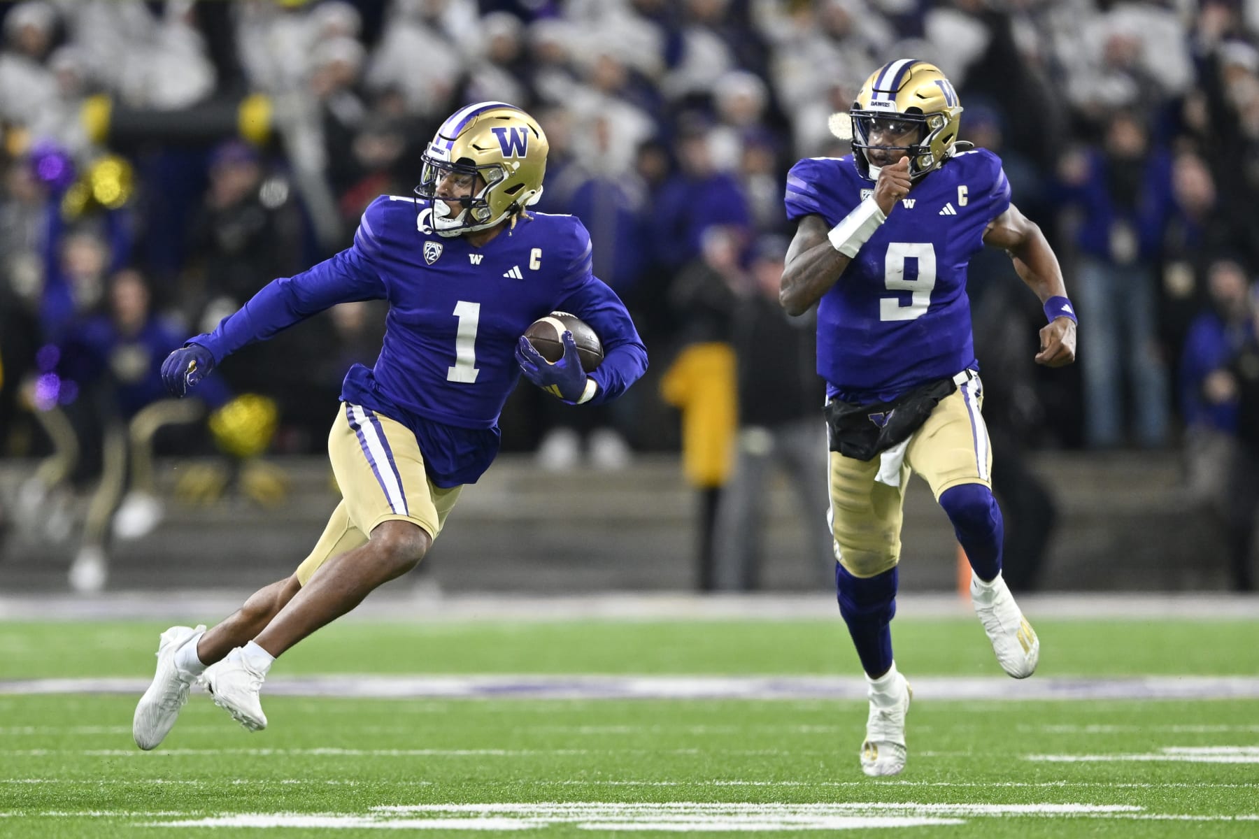 SEATTLE, WASHINGTON - NOVEMBER 25: Rome Odunze #1 of the Washington Huskies runs the ball during the fourth quarter against the Washington State Cougars at Husky Stadium on November 25, 2023 in Seattle, Washington. The Washington Huskies won 24-21. (Photo by Alika Jenner/Getty Images)