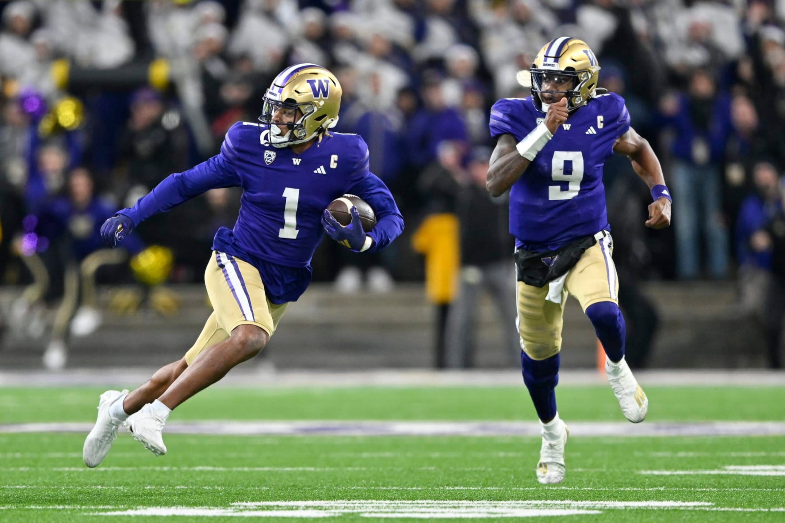SEATTLE, WASHINGTON - NOVEMBER 25: Rome Odunze #1 of the Washington Huskies runs the ball during the fourth quarter against the Washington State Cougars at Husky Stadium on November 25, 2023 in Seattle, Washington. The Washington Huskies won 24-21. (Photo by Alika Jenner/Getty Images)