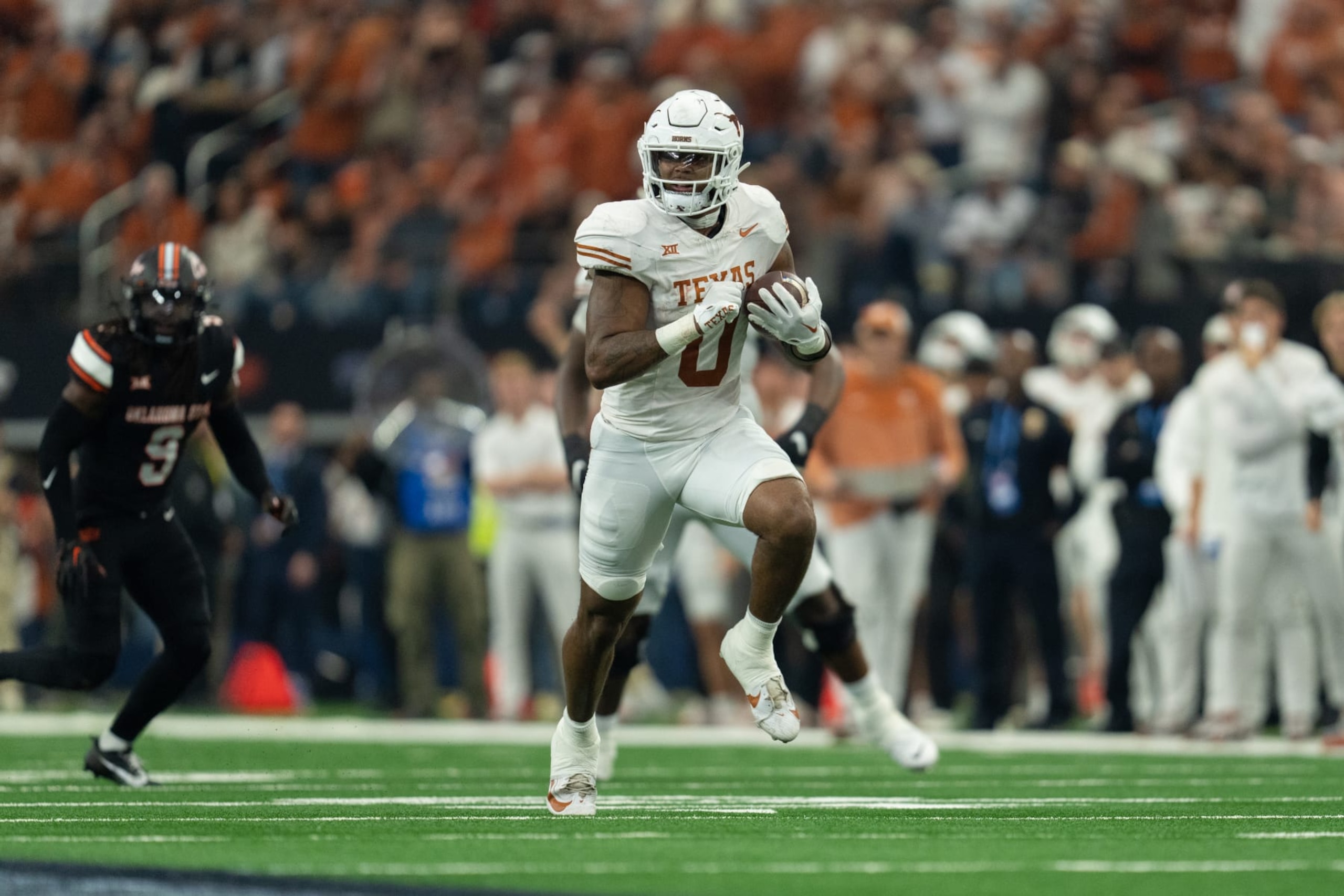 ARLINGTON, TEXAS - DECEMBER 2:  Ja'Tavion Sanders #0 of the Texas Longhorns runs with the ball after catching a pass at the Big 12 Championship match between Oklahoma State and Texasat AT&T Stadium on December 2, 2023 in Arlington, Texas. (Photo by Caten Hyde/The University of Texas Athletics/Getty Images)