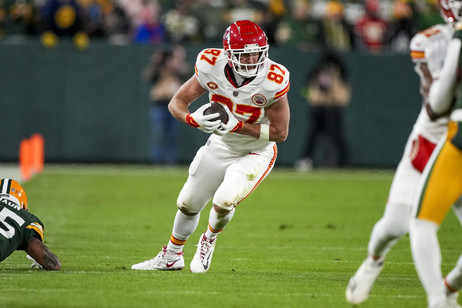 GREEN BAY, WI - DECEMBER 3: Tight end Travis Kelce #87 of the Kansas City Chiefs runs the ball during an NFL football game against the Green Bay Packers at Lambeau Field on December 3, 2023 in Green Bay, Wisconsin. (Photo by Todd Rosenberg/Getty Images)
