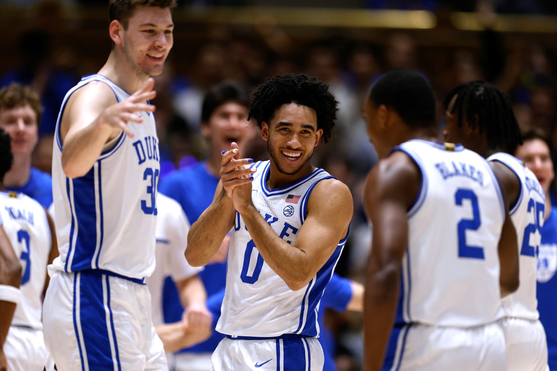 DURHAM, NORTH CAROLINA - DECEMBER 9: Jared McCain #0 of the Duke Blue Devils reacts with teammates during the first half of the game against the Charlotte 49ers at Cameron Indoor Stadium on December 9, 2023 in Durham, North Carolina. (Photo by Lance King/Getty Images)