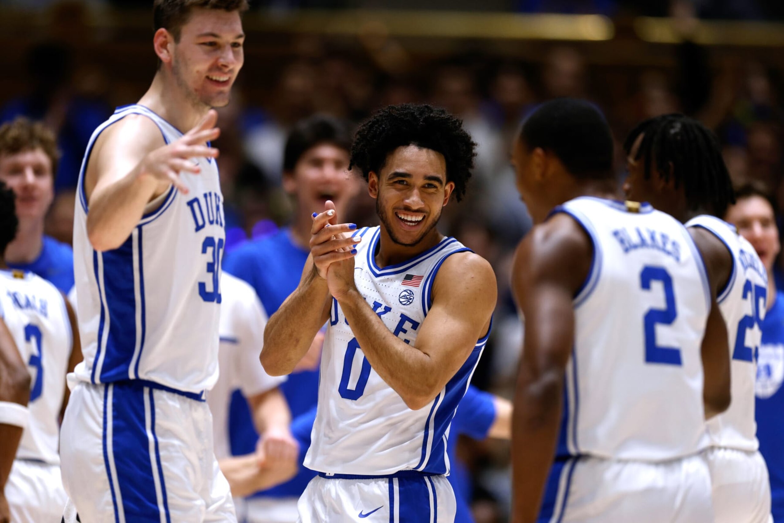 DURHAM, NORTH CAROLINA - DECEMBER 9: Jared McCain #0 of the Duke Blue Devils reacts with teammates during the first half of the game against the Charlotte 49ers at Cameron Indoor Stadium on December 9, 2023 in Durham, North Carolina. (Photo by Lance King/Getty Images)