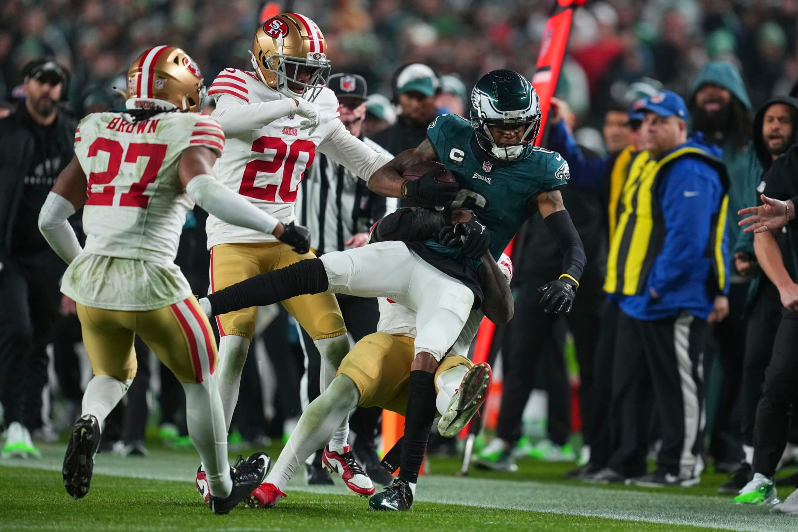 PHILADELPHIA, PENNSYLVANIA - DECEMBER 3: Dre Greenlaw #57 of the San Francisco 49ers tackles DeVonta Smith #6 of the Philadelphia Eagles at Lincoln Financial Field on December 3, 2023 in Philadelphia, Pennsylvania. (Photo by Mitchell Leff/Getty Images) PHILADELPHIA, PENNSYLVANIA - DECEMBER 3: Dre Greenlaw #57 of the San Francisco 49ers tackles DeVonta Smith #6 of the Philadelphia Eagles at Lincoln Financial Field on December 3, 2023 in Philadelphia, Pennsylvania. (Photo by Mitchell Leff/Getty Images)