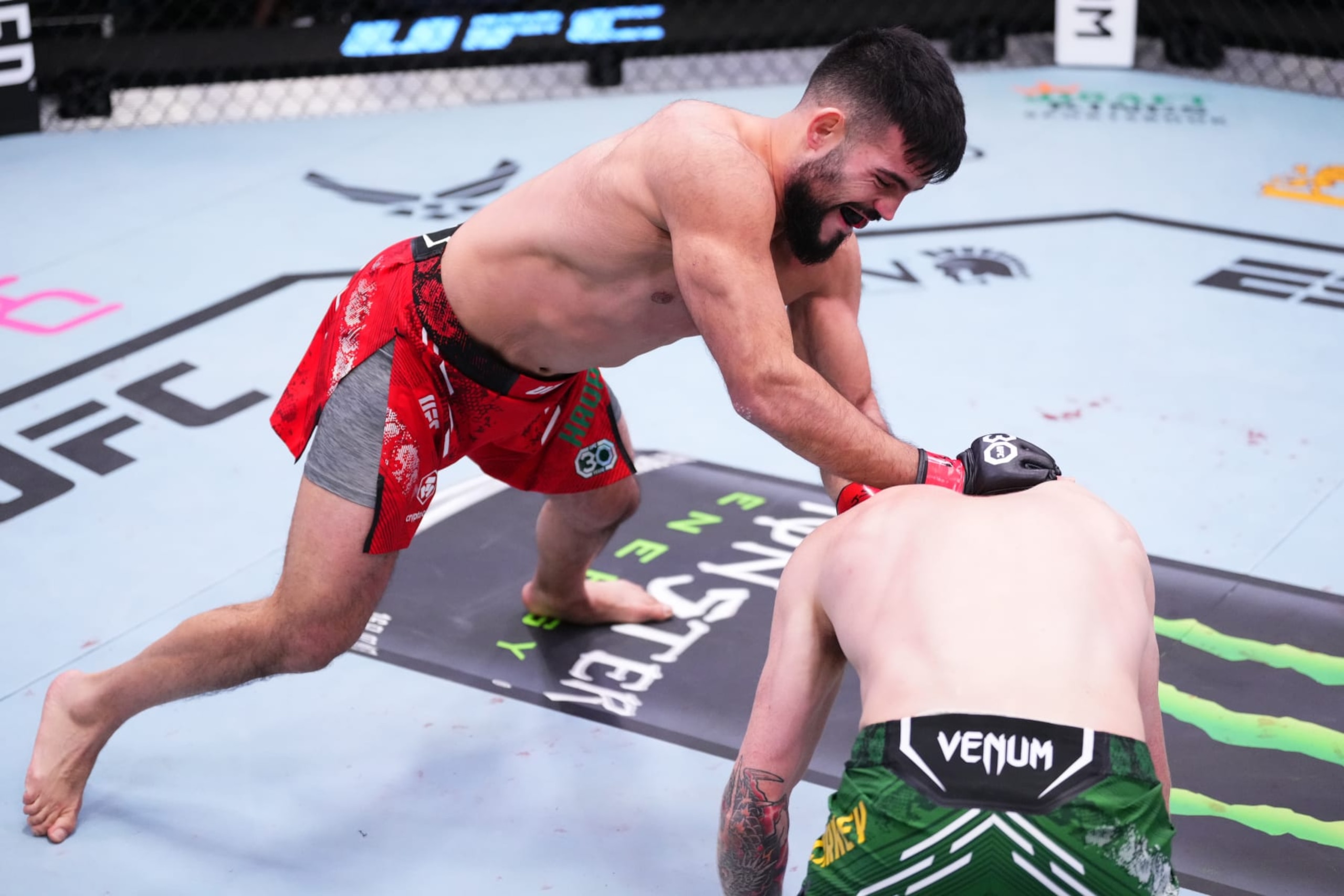 Nasrat Haqparast of Germany punches Jamie Mullarkey of Australia