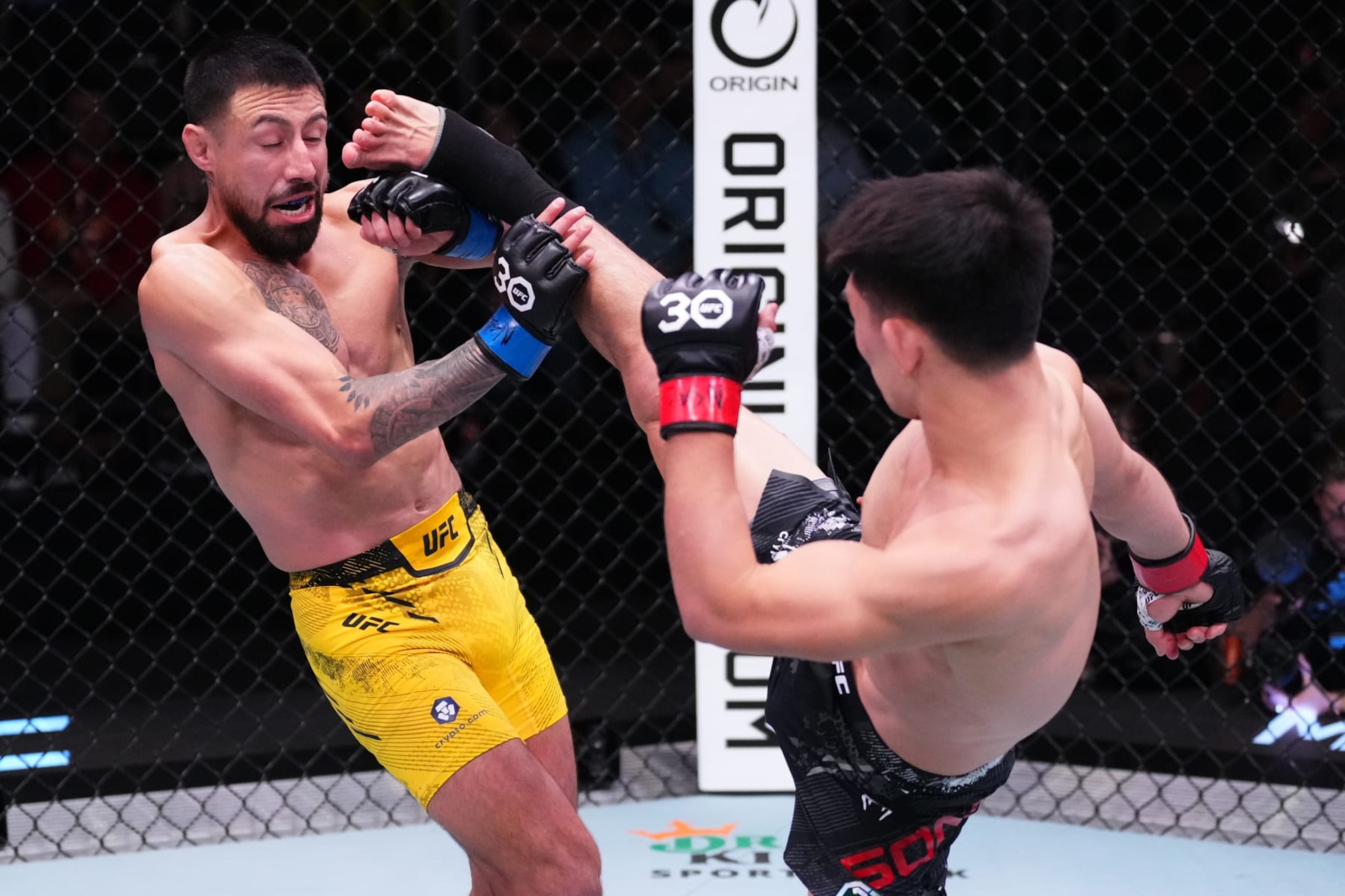 Song Yadong of China kicks Chris Gutierrez