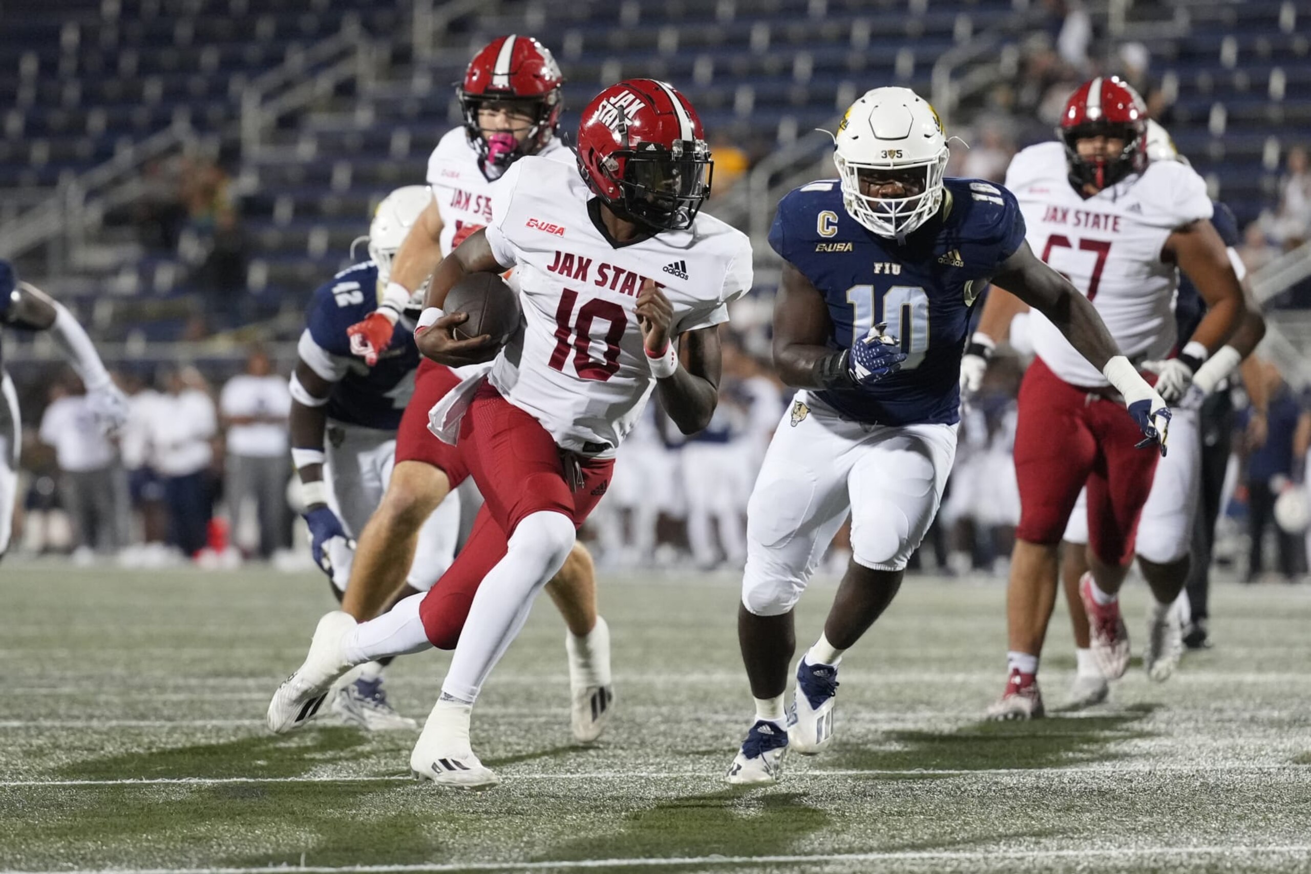 MIAMI, FL - OCTOBER 25: Jacksonville State Gamecocks quarterback Zion Webb (10) rushes for a touchdown in the first quarter during the game between the Jacksonville State Gamecocks and the Florida International (FIU) Golden Panthers on Wednesday, October 25, 202 at Ricardo Silva Stadium, Miami, Fla. (Photo by Peter Joneleit/Icon Sportswire via Getty Images)