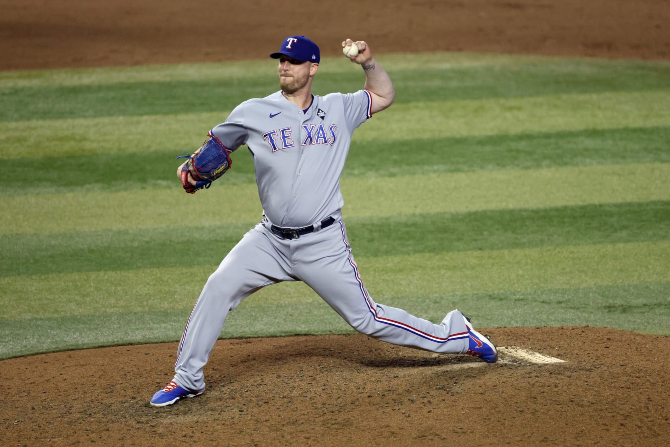 PHOENIX, ARIZONA - OCTOBER 31: Will Smith #51 of the Texas Rangers pitches in the ninth inning against the Arizona Diamondbacks during Game Four of the World Series at Chase Field on October 31, 2023 in Phoenix, Arizona. (Photo by Jamie Squire/Getty Images) PHOENIX, ARIZONA - OCTOBER 31: Will Smith #51 of the Texas Rangers pitches in the ninth inning against the Arizona Diamondbacks during Game Four of the World Series at Chase Field on October 31, 2023 in Phoenix, Arizona. (Photo by Jamie Squire/Getty Images)