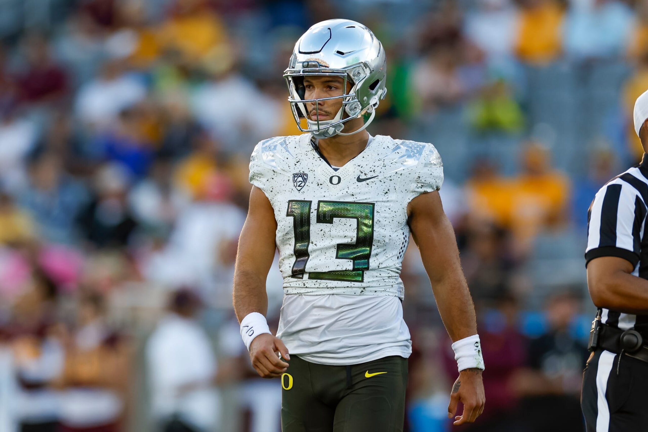 TEMPE, ARIZONA - NOVEMBER 18: Ty Thompson #13 of the Oregon Ducks walks on the field during a game against the Arizona State Sun Devils at Mountain America Stadium on November 18, 2023 in Tempe, Arizona. (Photo by Brandon Sloter/Image Of Sport/Getty Images)