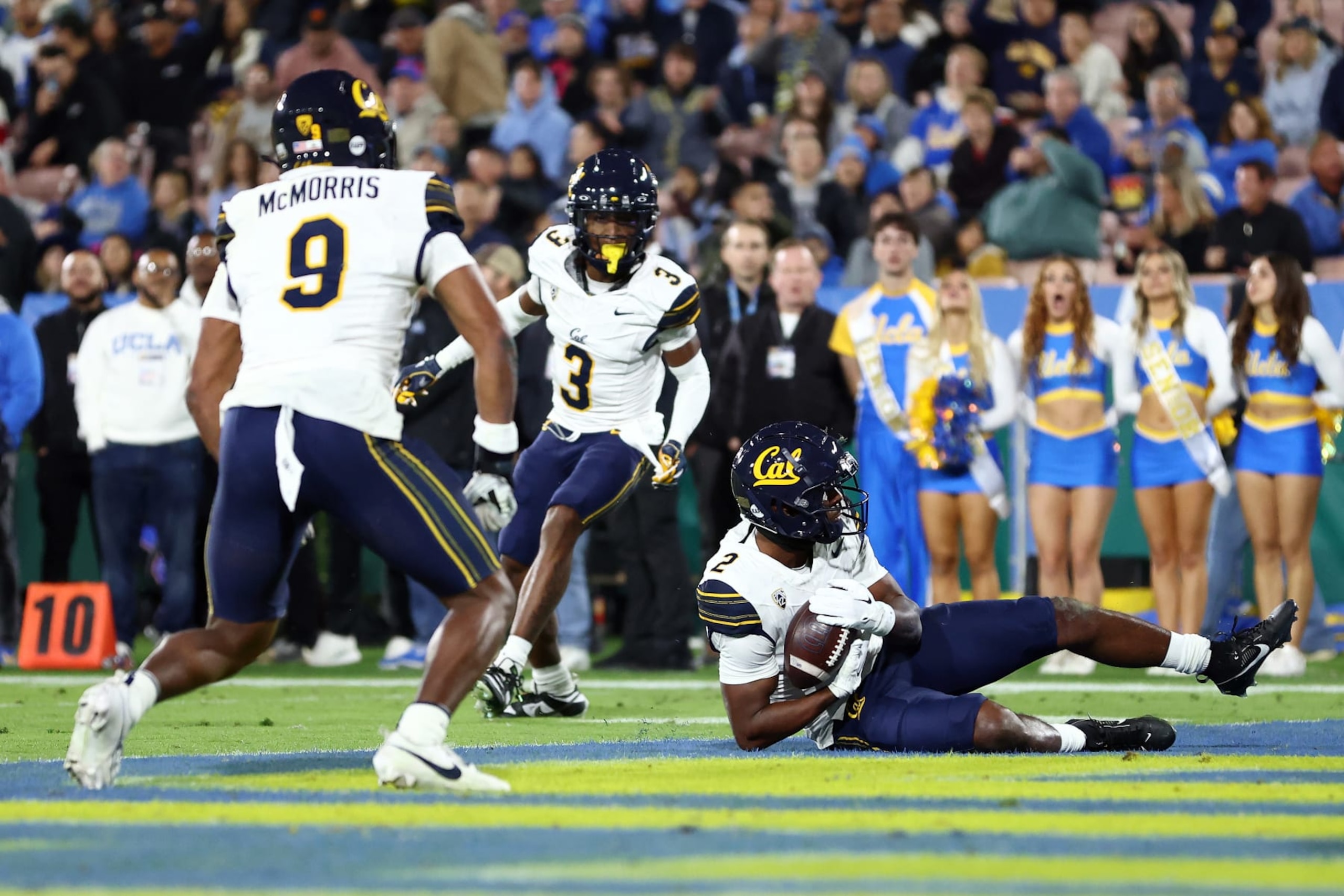 PASADENA, CALIFORNIA - NOVEMBER 25: Craig Woodson #2 of the California Golden Bears intercepts the ball during the first quarter against the UCLA Bruins at Rose Bowl Stadium on November 25, 2023 in Pasadena, California. (Photo by Katelyn Mulcahy/Getty Images)