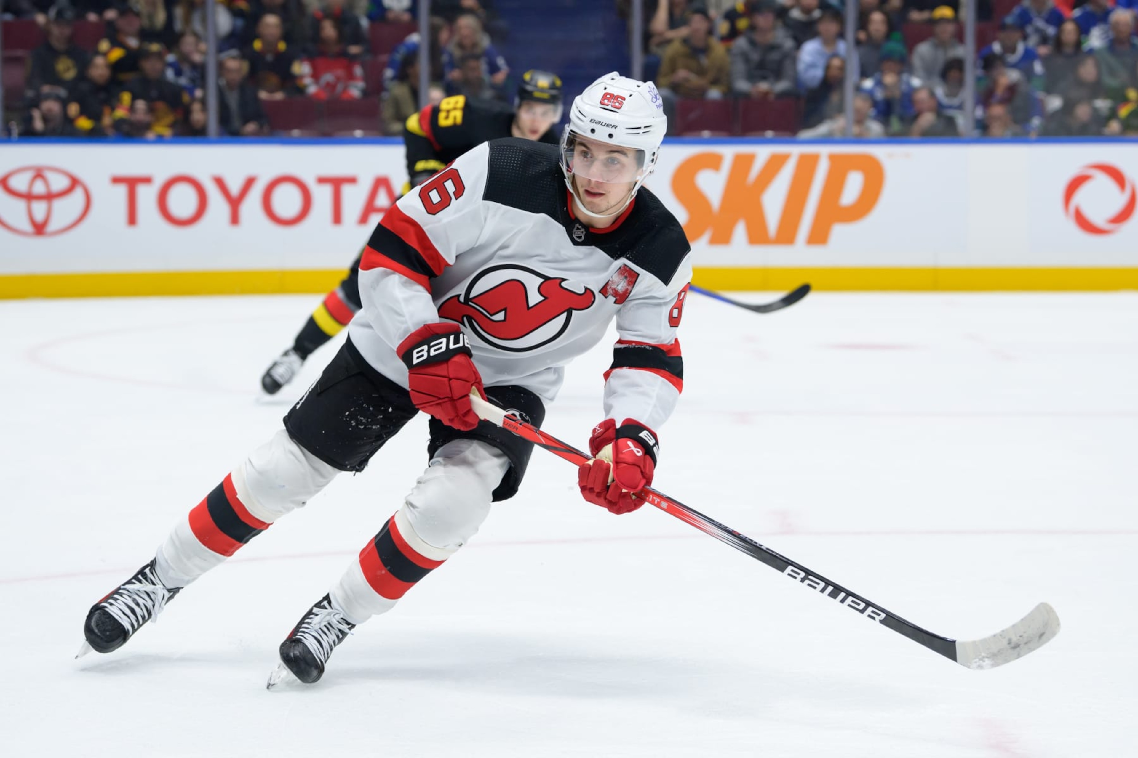 VANCOUVER, CANADA - DECEMBER 5: Jack Hughes #86 of the New Jersey Devils skates during the first period of their NHL game against the Vancouver Canucks at Rogers Arena on December 5, 2023 in Vancouver, British Columbia, Canada. (Photo by Derek Cain/Getty Images) VANCOUVER, CANADA - DECEMBER 5: Jack Hughes #86 of the New Jersey Devils skates during the first period of their NHL game against the Vancouver Canucks at Rogers Arena on December 5, 2023 in Vancouver, British Columbia, Canada. (Photo by Derek Cain/Getty Images)