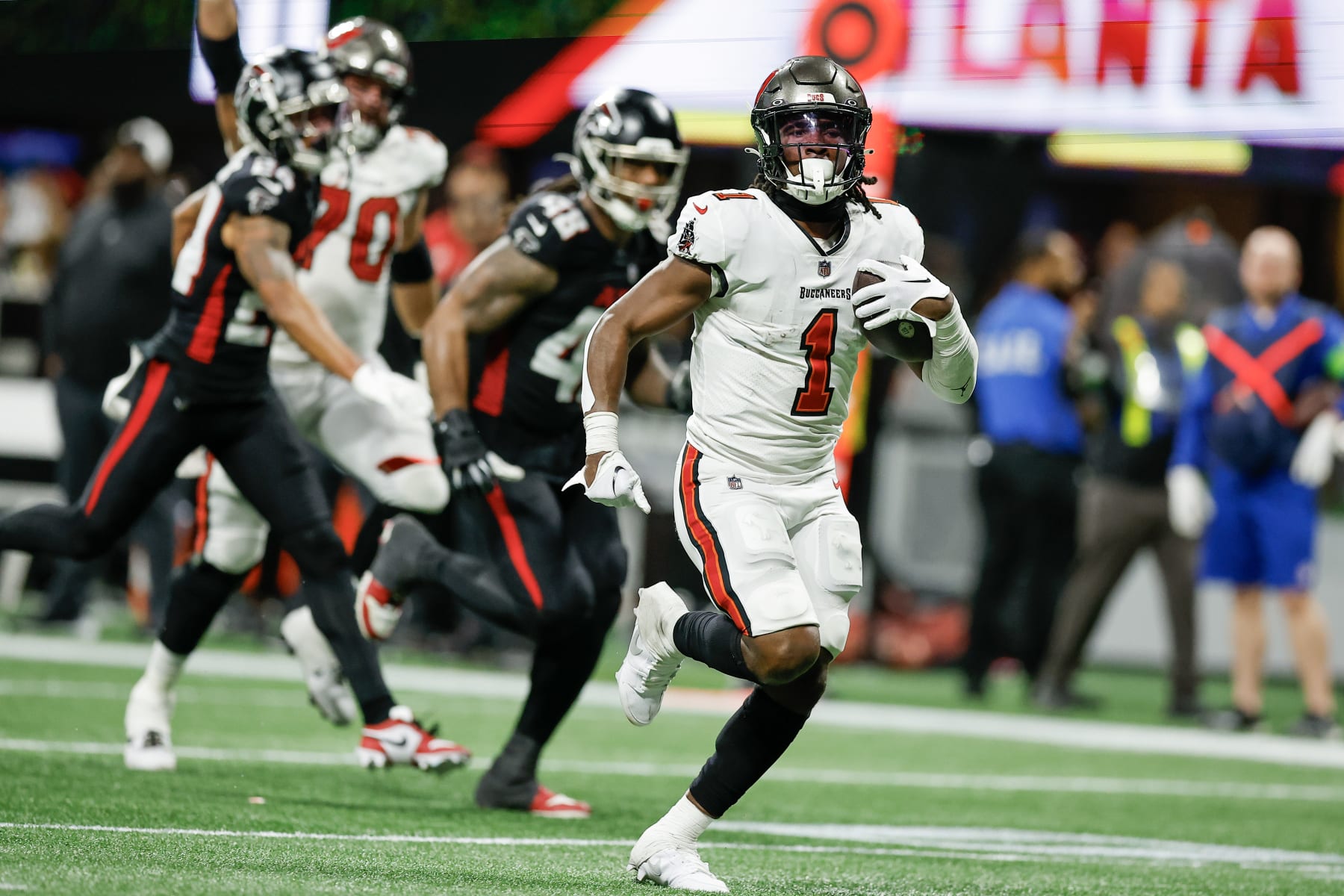 ATLANTA, GEORGIA - DECEMBER 10: Rachaad White #1 of the Tampa Bay Buccaneers carries the ball during the second half of the game against the Atlanta Falcons at Mercedes-Benz Stadium on December 10, 2023 in Atlanta, Georgia. (Photo by Alex Slitz/Getty Images)