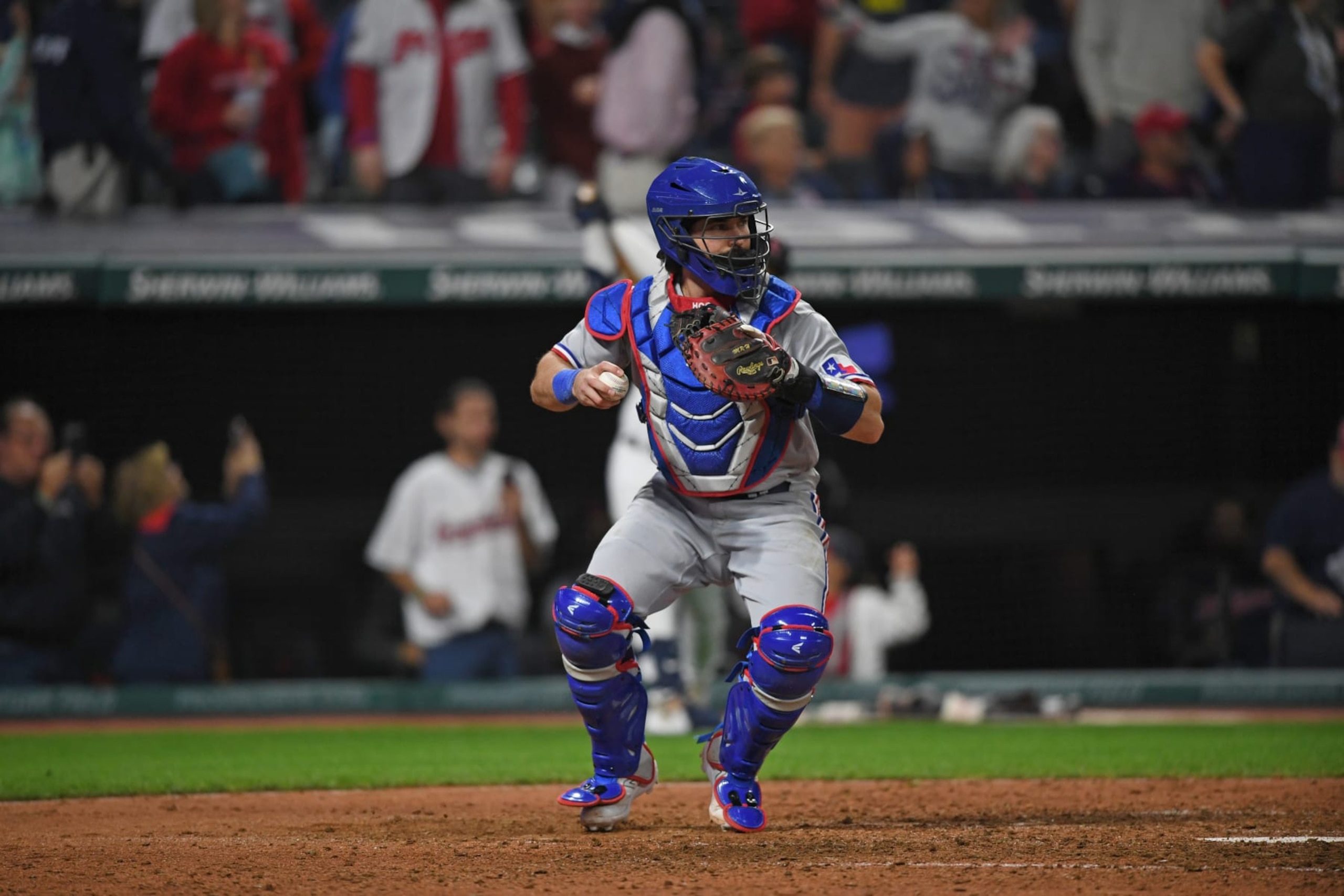 CLEVELAND, OHIO - SEPTEMBER 15, 2023: Austin Hedges #11 of the Texas Rangers throws to second base during the seventh inning against the Cleveland Guardians at Progressive Field on September 15, 2023 in Cleveland, Ohio. (Photo by George Kubas/Diamond Images via Getty Images) CLEVELAND, OHIO - SEPTEMBER 15, 2023: Austin Hedges #11 of the Texas Rangers throws to second base during the seventh inning against the Cleveland Guardians at Progressive Field on September 15, 2023 in Cleveland, Ohio. (Photo by George Kubas/Diamond Images via Getty Images)
