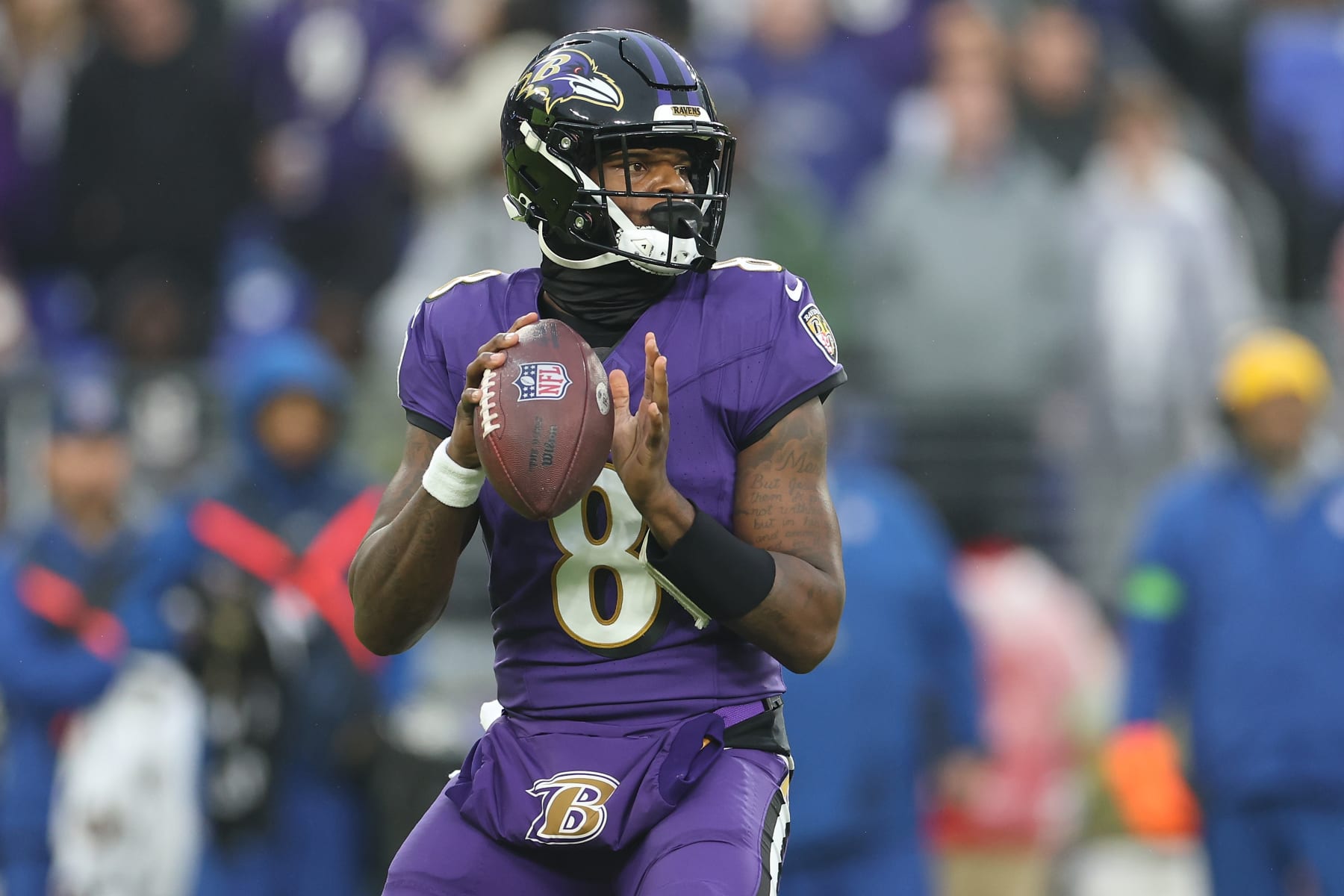 BALTIMORE, MARYLAND - DECEMBER 10: Lamar Jackson #8 of the Baltimore Ravens looks to pass during the second quarter in the game against the Los Angeles Rams at M&T Bank Stadium on December 10, 2023 in Baltimore, Maryland. (Photo by Rob Carr/Getty Images)