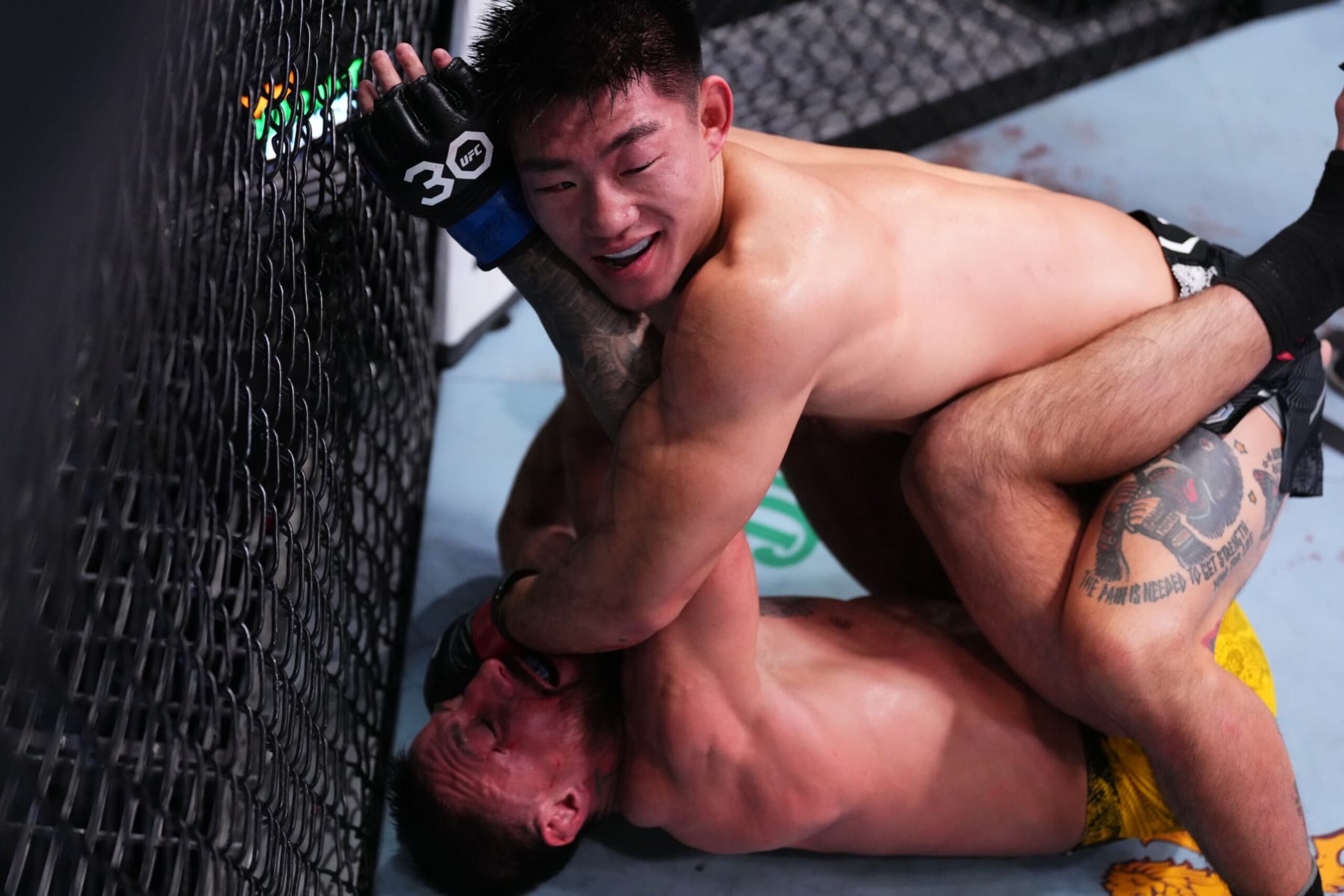 LAS VEGAS, NEVADA - DECEMBER 09: (R-L) Song Yadong of China battles Chris Gutierrez in a bantamweight fight during the UFC Fight Night event at UFC APEX on December 09, 2023 in Las Vegas, Nevada. (Photo by Jeff Bottari/Zuffa LLC via Getty Images)