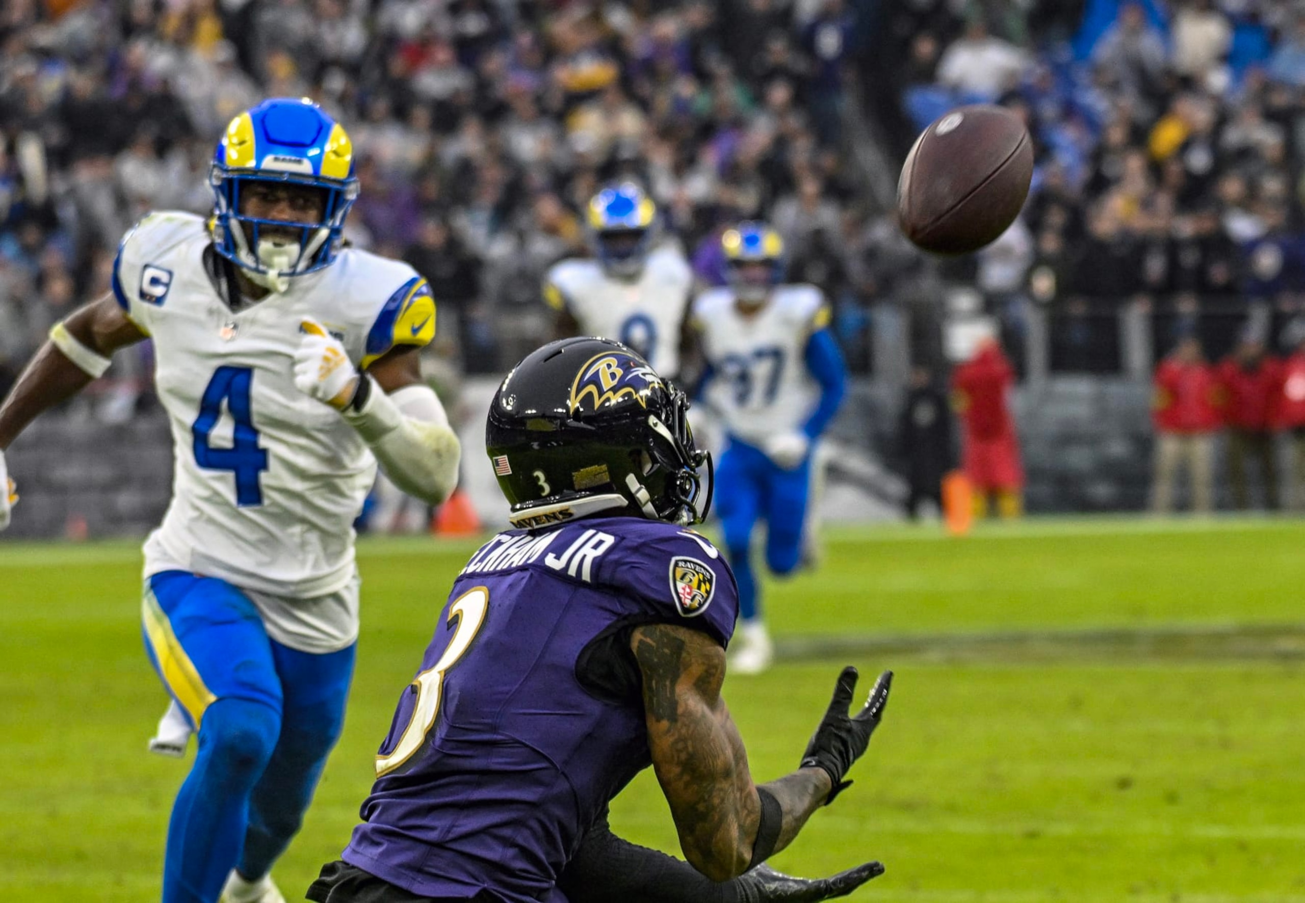 BALTIMORE, MD - DECEMBER 10:  Baltimore Ravens wide receiver Odell Beckham Jr. (3) catches a touchdown  pass against Los Angeles Rams safety Jordan Fuller (4) during the Los Angeles Rams game versus the Baltimore Ravens on December 10, 2023 at M&T Bank Stadium in Baltimore, MD.  (Photo by Mark Goldman/Icon Sportswire via Getty Images)