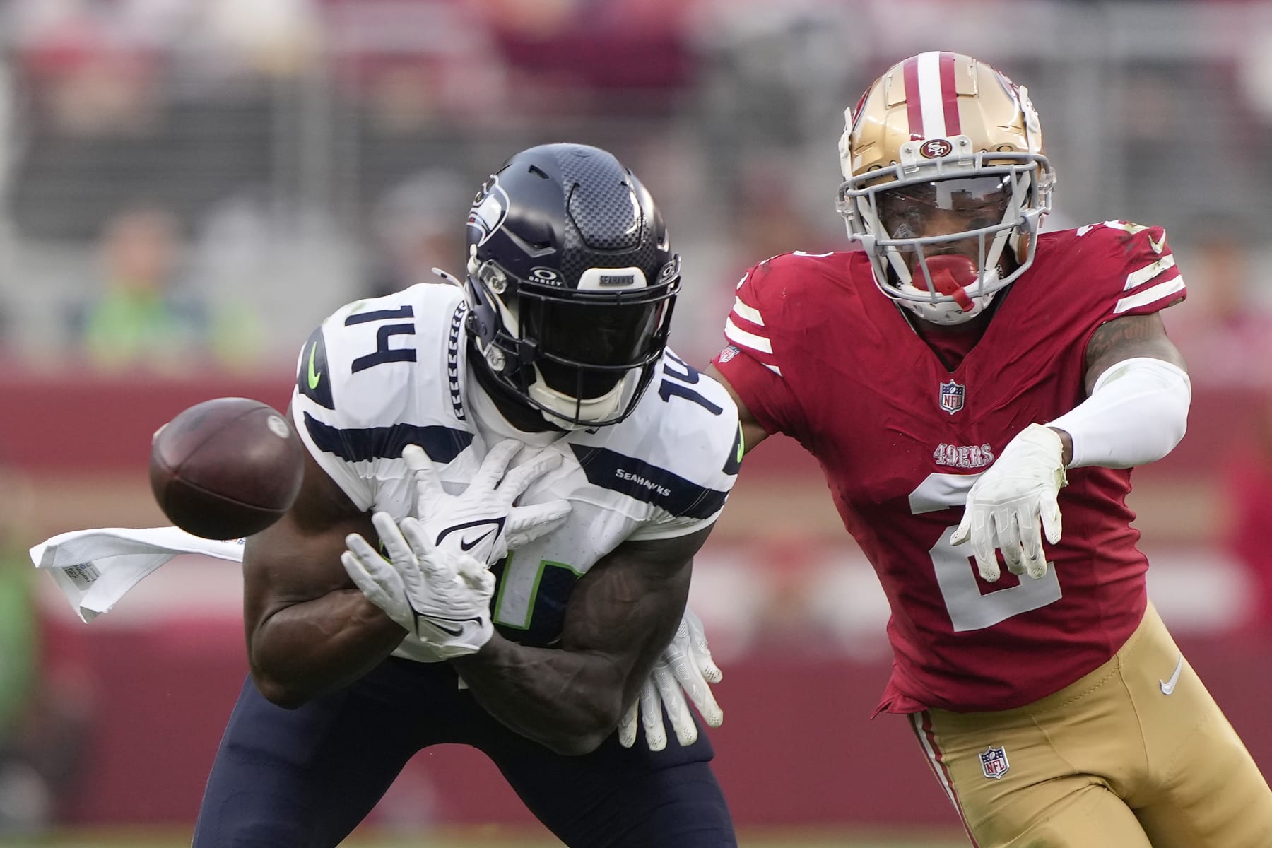 SANTA CLARA, CALIFORNIA - DECEMBER 10: Deommodore Lenoir #2 of the San Francisco 49ers breaks up a pass intended for DK Metcalf #14 of the Seattle Seahawks during the fourth quarter at Levi's Stadium on December 10, 2023 in Santa Clara, California. (Photo by Thearon W. Henderson/Getty Images)