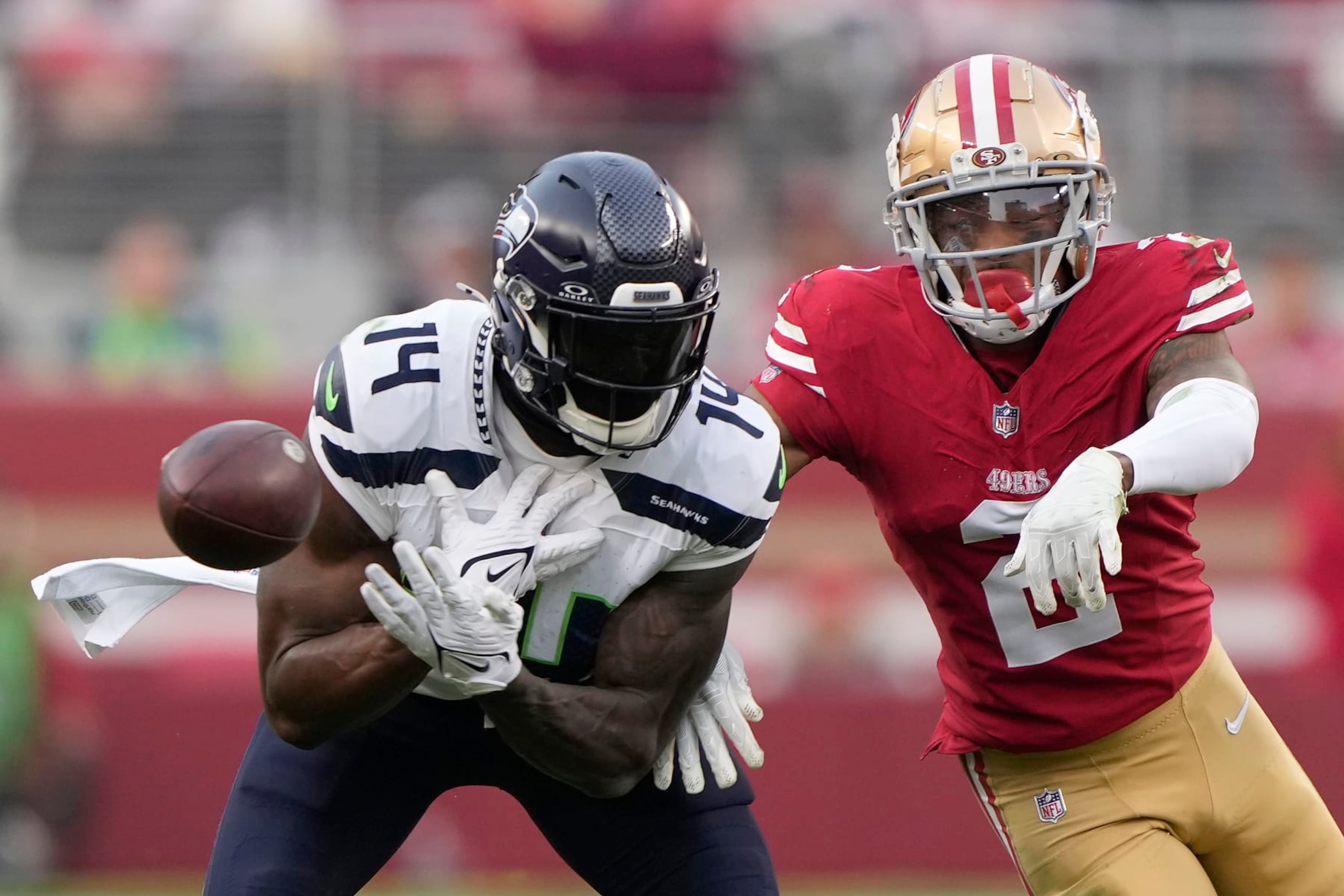 SANTA CLARA, CALIFORNIA - DECEMBER 10: Deommodore Lenoir #2 of the San Francisco 49ers breaks up a pass intended for DK Metcalf #14 of the Seattle Seahawks during the fourth quarter at Levi's Stadium on December 10, 2023 in Santa Clara, California. (Photo by Thearon W. Henderson/Getty Images)