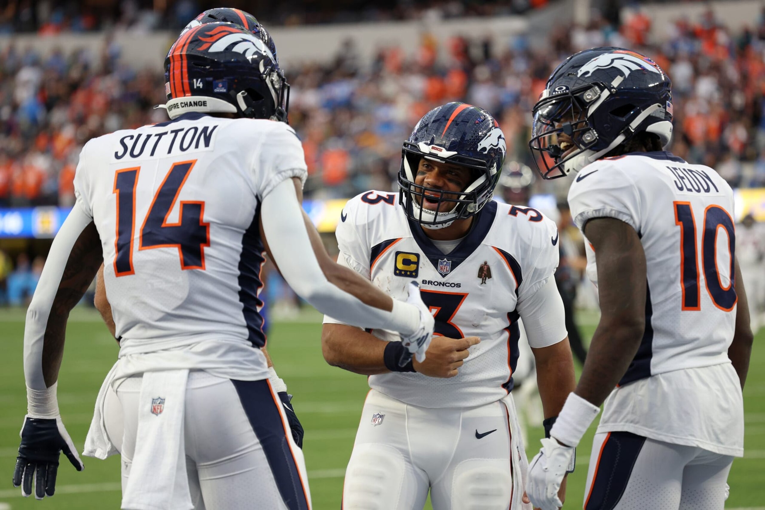 INGLEWOOD, CALIFORNIA - DECEMBER 10: Russell Wilson #3 of the Denver Broncos celebrates a touchdown pass with Courtland Sutton #14 of the Denver Broncos during the third quarter at SoFi Stadium on December 10, 2023 in Inglewood, California. (Photo by Harry How/Getty Images)