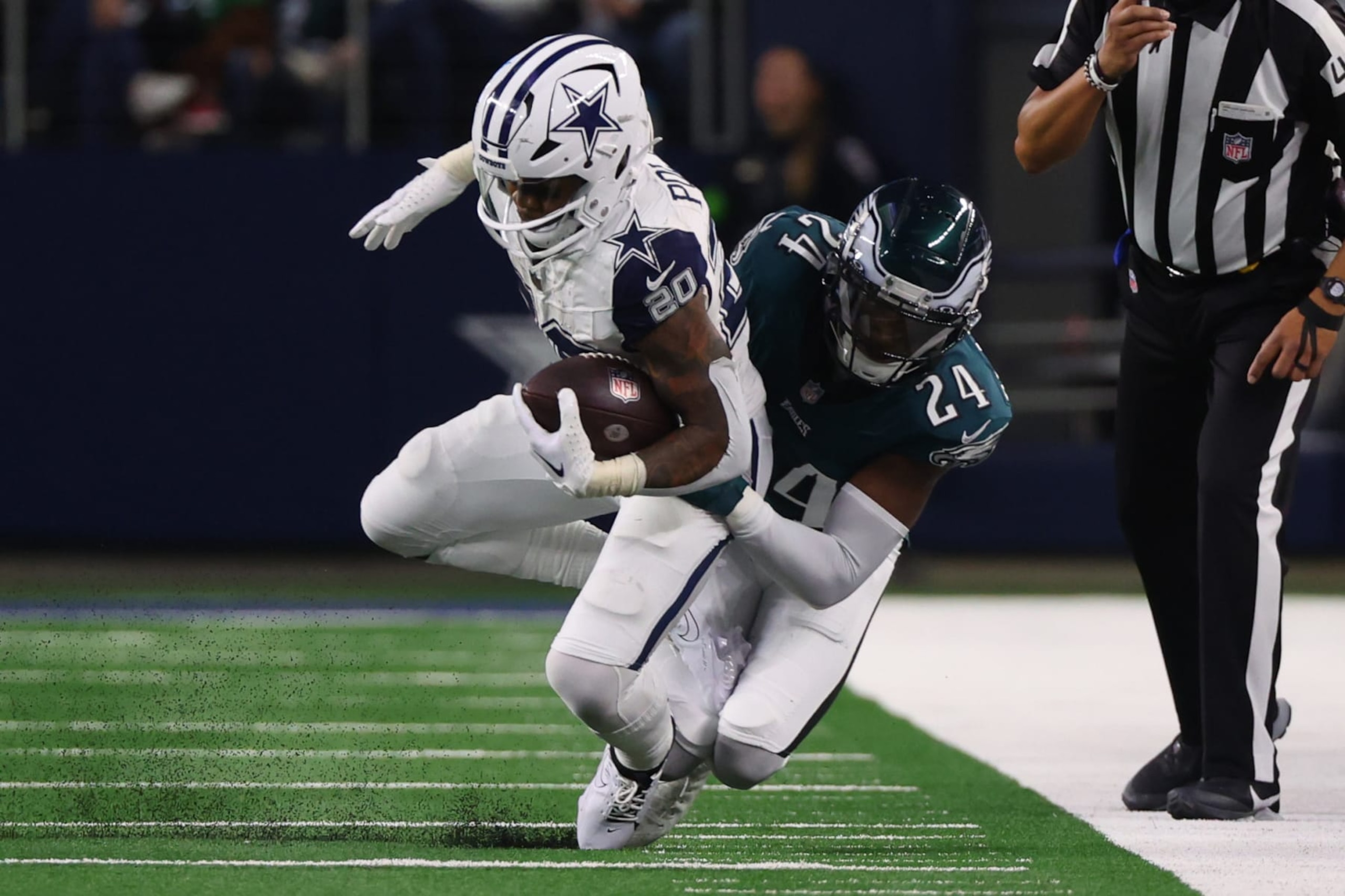 ARLINGTON, TEXAS - DECEMBER 10: Tony Pollard #20 of the Dallas Cowboys is tackled by James Bradberry #24 of the Philadelphia Eagles during the second half at AT&T Stadium on December 10, 2023 in Arlington, Texas. (Photo by Richard Rodriguez/Getty Images)