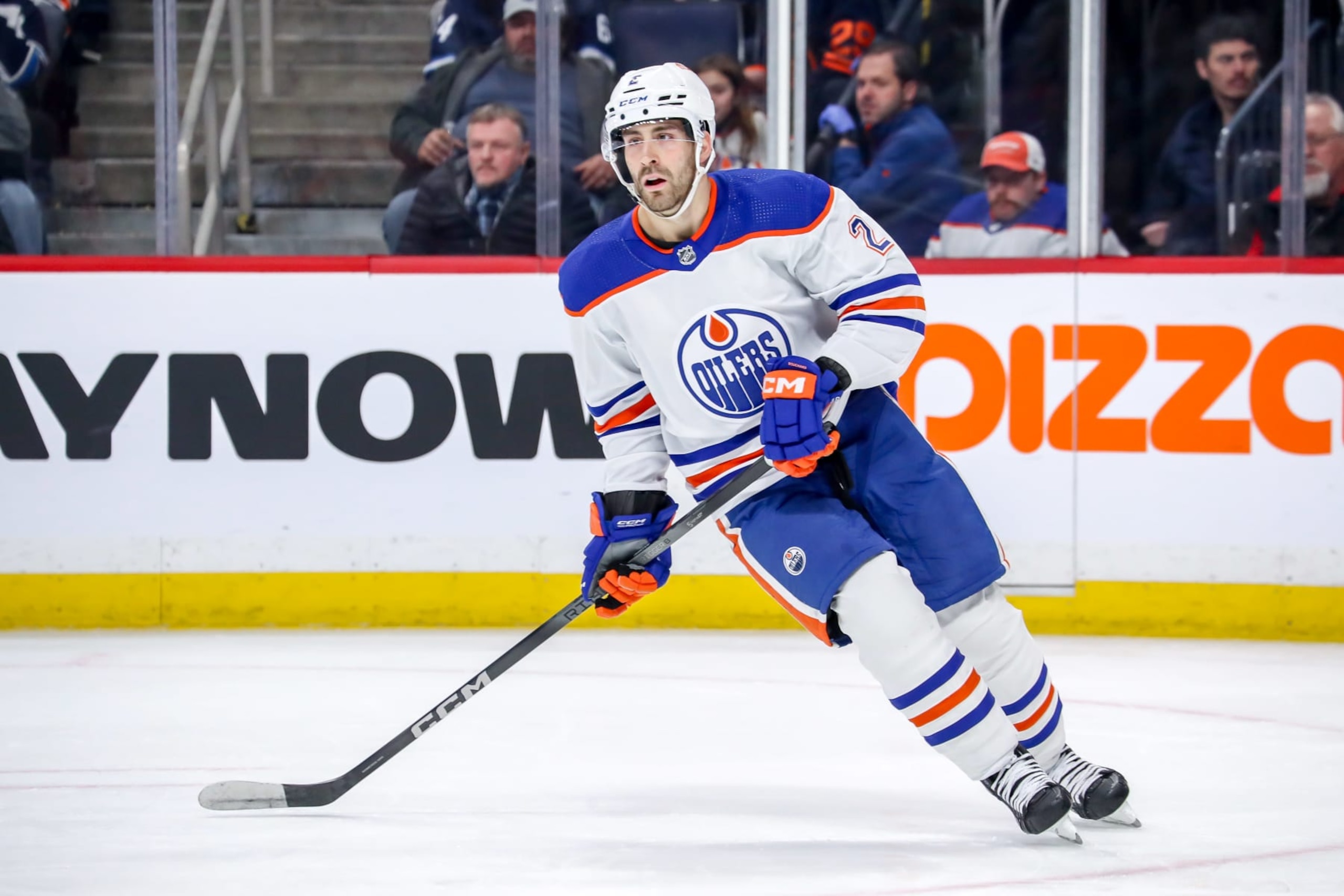 WINNIPEG, CANADA - NOVEMBER 30: Evan Bouchard #2 of the Edmonton Oilers keeps an eye on the play during third period action against the Winnipeg Jets at the Canada Life Centre on November 30, 2023 in Winnipeg, Manitoba, Canada. The Oilers defeated the Jets 3-1. (Photo by Darcy Finley/NHLI via Getty Images)
