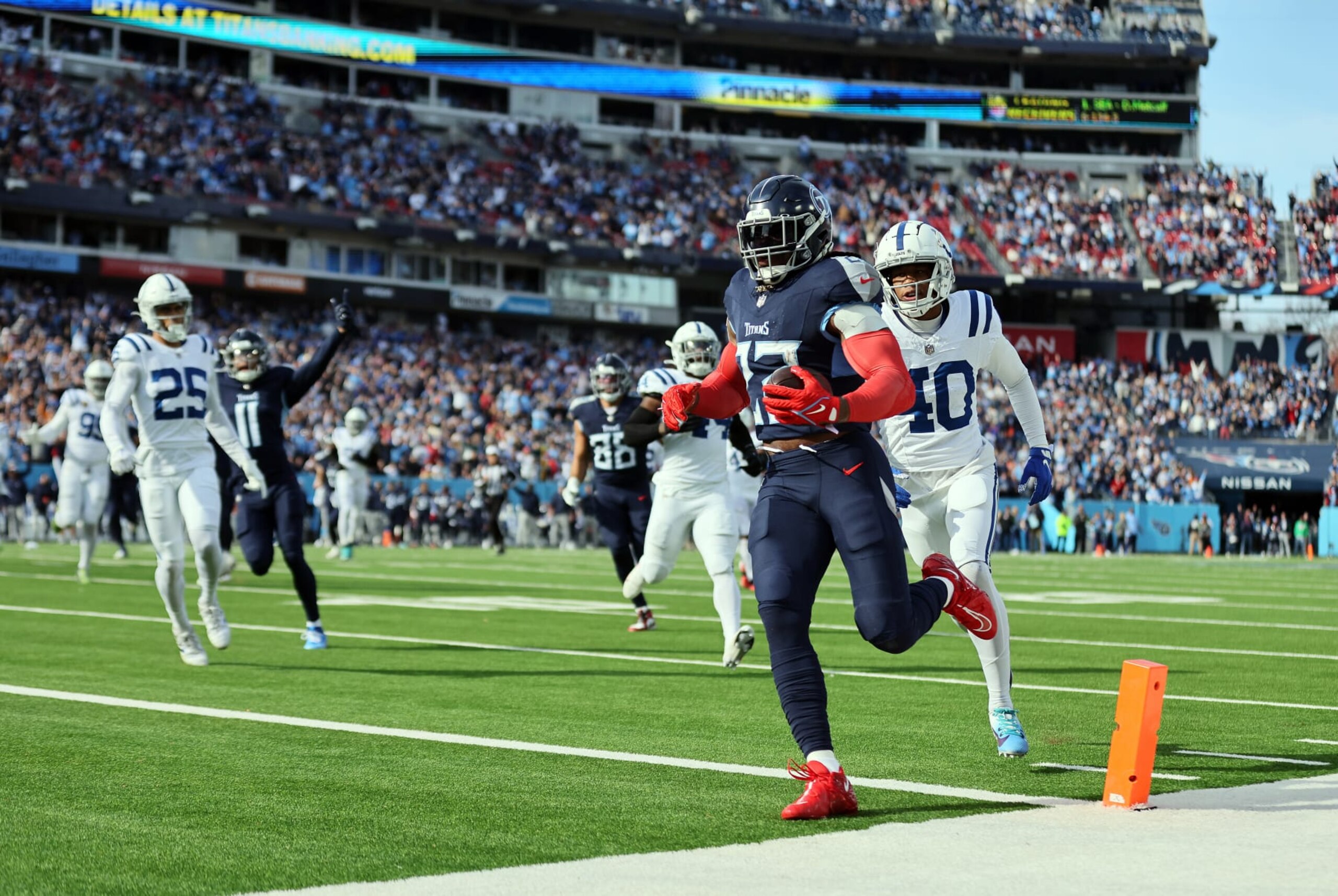 NASHVILLE, TENNESSEE - DECEMBER 03: Derrick Henry #22 of the Tennessee Titans carries the ball for a touchdown against the Indianapolis Colts during the first quarter of the game at Nissan Stadium on December 03, 2023 in Nashville, Tennessee. (Photo by Andy Lyons/Getty Images)