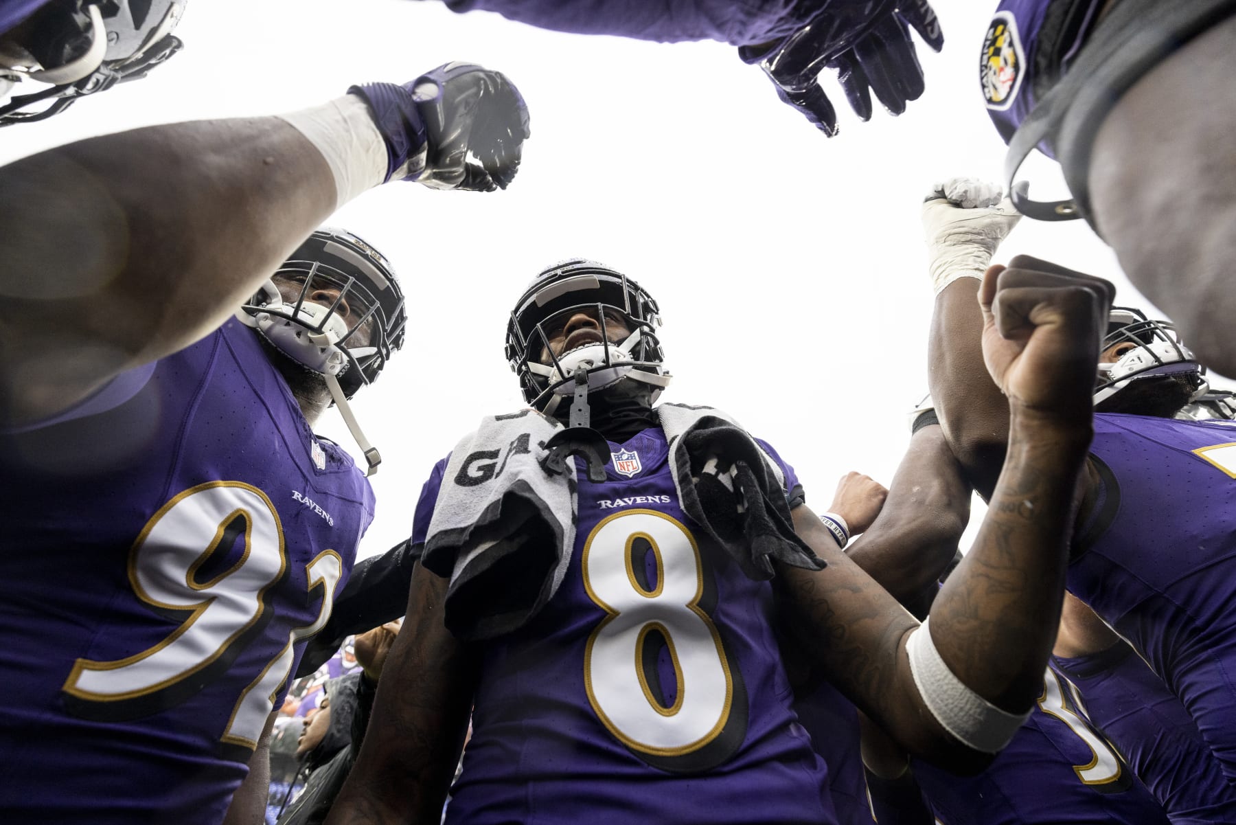 BALTIMORE, MARYLAND - DECEMBER 10: Lamar Jackson #8 of the Baltimore Ravens looks on during a huddle prior to an NFL football game between the Baltimore Ravens and the Los Angeles Rams at M&T Bank Stadium on December 10, 2023 in Baltimore, Maryland. (Photo by Michael Owens/Getty Images)