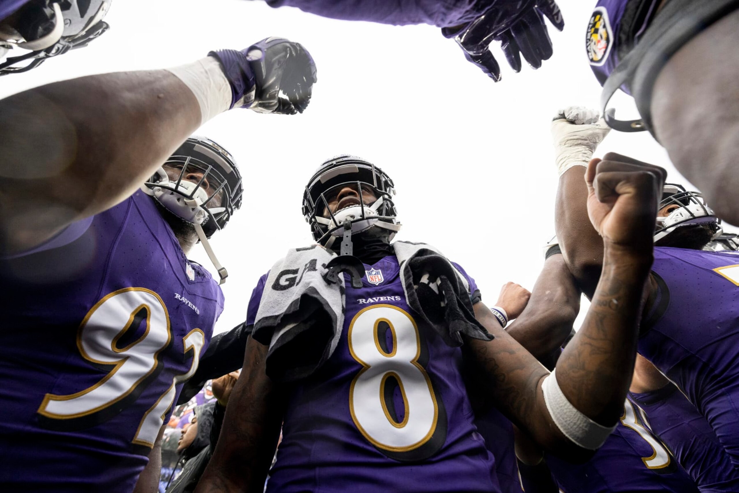 BALTIMORE, MARYLAND - DECEMBER 10: Lamar Jackson #8 of the Baltimore Ravens looks on during a huddle prior to an NFL football game between the Baltimore Ravens and the Los Angeles Rams at M&T Bank Stadium on December 10, 2023 in Baltimore, Maryland. (Photo by Michael Owens/Getty Images)