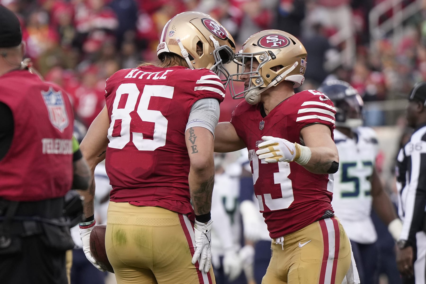 SANTA CLARA, CALIFORNIA - DECEMBER 10: George Kittle #85 of the San Francisco 49ers celebrates after a touchdown with Christian McCaffrey #23 of the San Francisco 49ers during the fourth quarter in the game against the Seattle Seahawks at Levi's Stadium on December 10, 2023 in Santa Clara, California. (Photo by Thearon W. Henderson/Getty Images)
