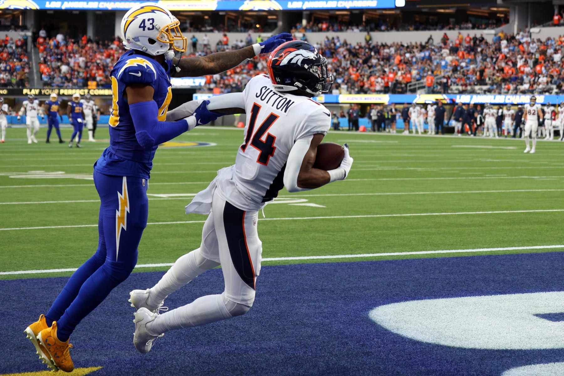 INGLEWOOD, CALIFORNIA - DECEMBER 10: Courtland Sutton #14 of the Denver Broncos catches a pass for a touchdown during the third quarter against the Los Angeles Chargers at SoFi Stadium on December 10, 2023 in Inglewood, California. (Photo by Harry How/Getty Images)