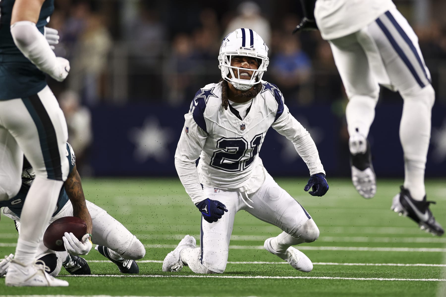 ARLINGTON, TX - DECEMBER 10: Stephon Gilmore #21 of the Dallas Cowboys celebrates after making a tackle during the third quarter of an NFL football game against the Philadelphia Eagles at AT&T Stadium on December 10, 2023 in Arlington, Texas. (Photo by Kevin Sabitus/Getty Images)