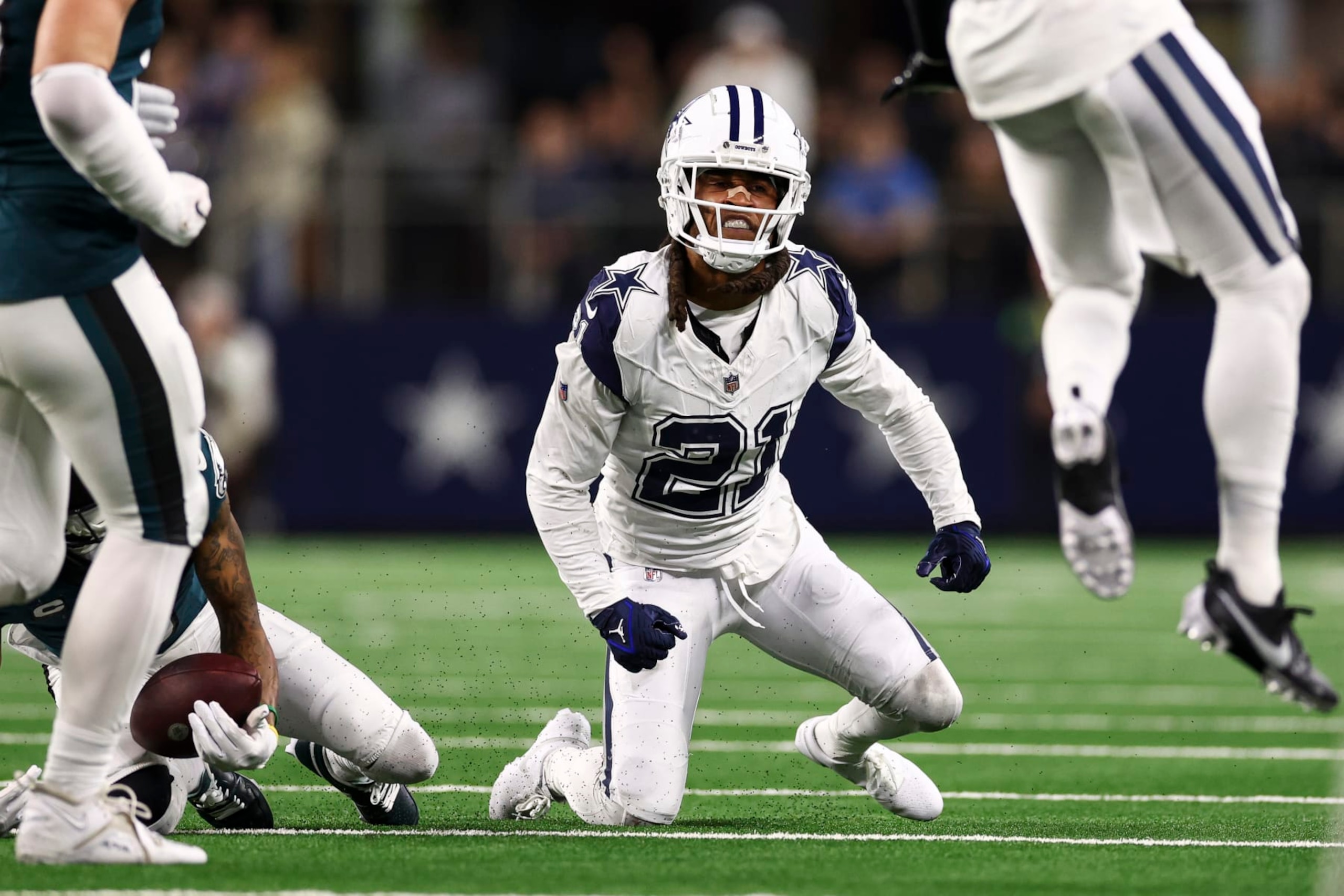 ARLINGTON, TX - DECEMBER 10: Stephon Gilmore #21 of the Dallas Cowboys celebrates after making a tackle during the third quarter of an NFL football game against the Philadelphia Eagles at AT&T Stadium on December 10, 2023 in Arlington, Texas. (Photo by Kevin Sabitus/Getty Images)