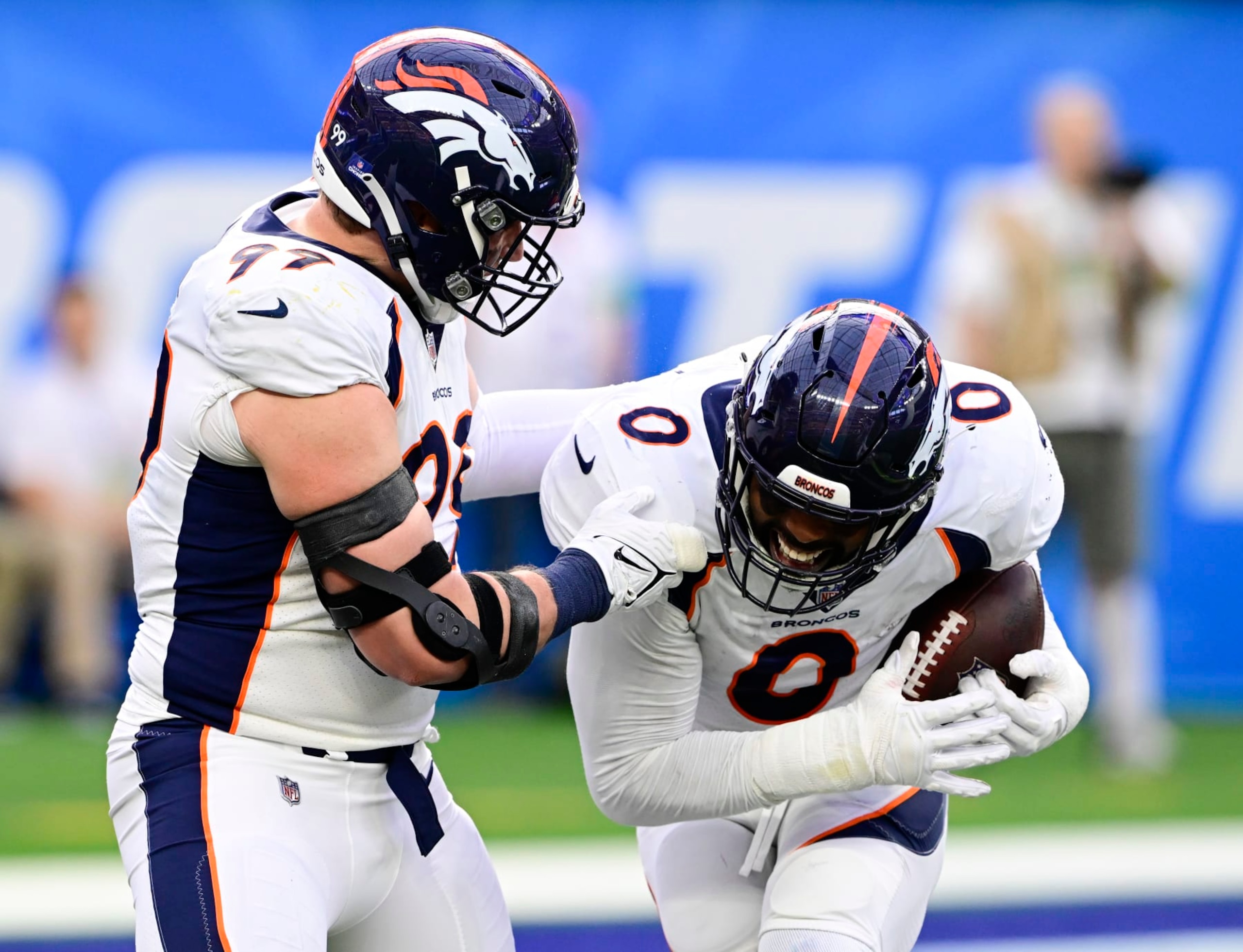 INGLEWOOD, CA - DECEMBER 10: Denver Broncos linebacker Jonathon Cooper (0) celebrates his interception from Los Angeles Chargers quarterback Justin Herbert (10) with teammate Zach Allen (99) in the first quarter at SoFi Stadium in Inglewood, California Sunday December 10, 2023. (Photo by Andy Cross/MediaNews Group/The Denver Post via Getty Images)