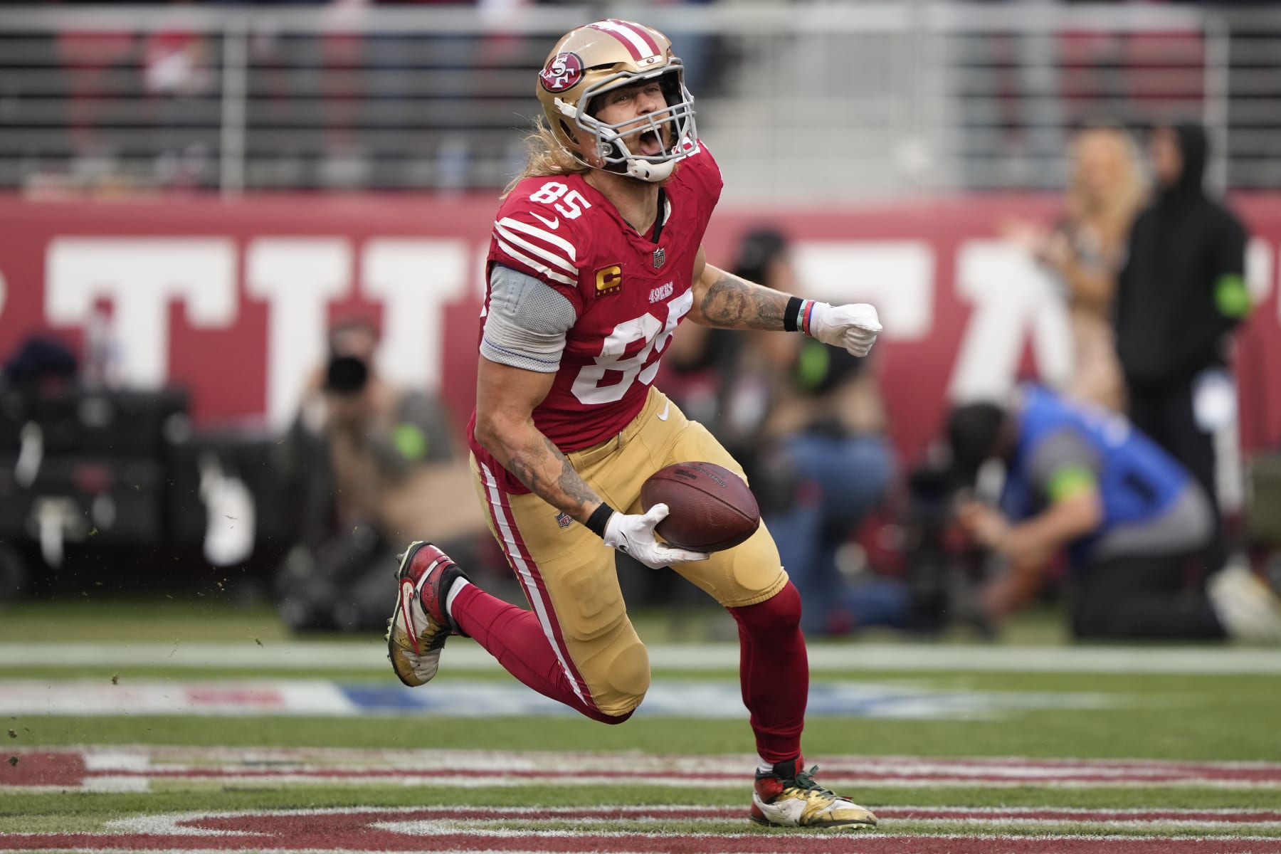 SANTA CLARA, CALIFORNIA - DECEMBER 10: George Kittle #85 of the San Francisco 49ers celebrates after a touchdown during the fourth quarter in the game against the Seattle Seahawks at Levi's Stadium on December 10, 2023 in Santa Clara, California. (Photo by Thearon W. Henderson/Getty Images)