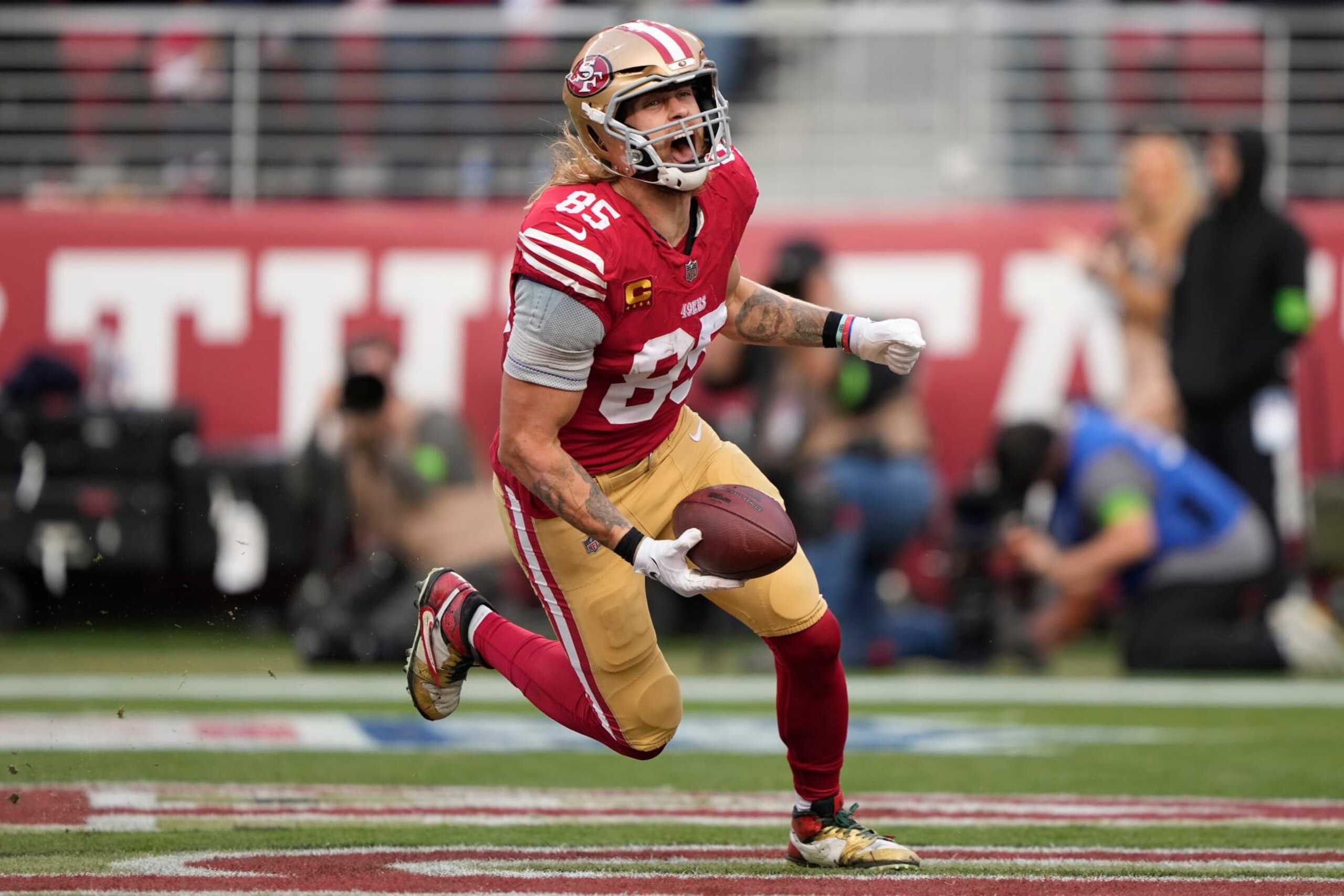 SANTA CLARA, CALIFORNIA - DECEMBER 10: George Kittle #85 of the San Francisco 49ers celebrates after a touchdown during the fourth quarter in the game against the Seattle Seahawks at Levi's Stadium on December 10, 2023 in Santa Clara, California. (Photo by Thearon W. Henderson/Getty Images)