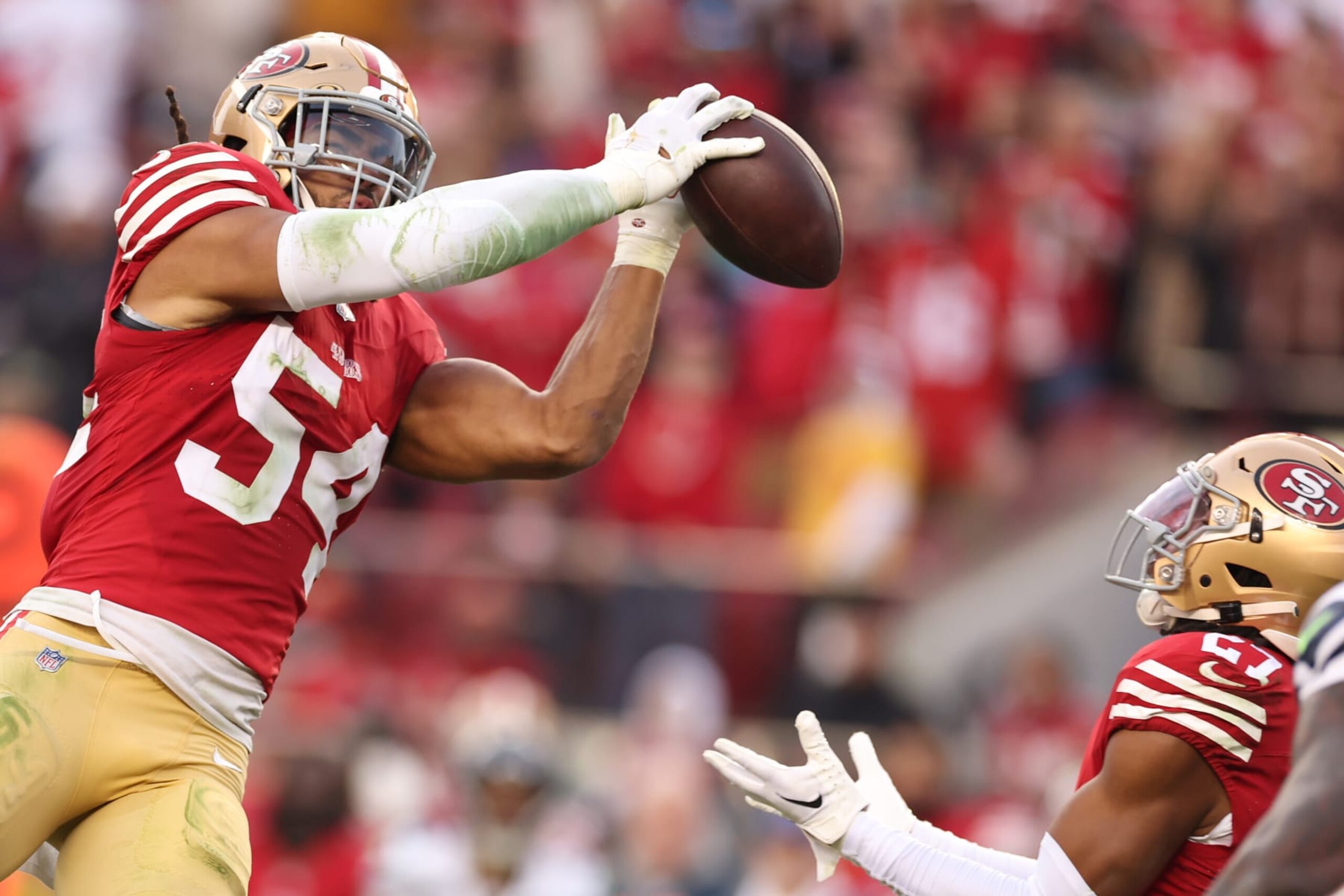SANTA CLARA, CALIFORNIA - DECEMBER 10: Fred Warner #54 of the San Francisco 49ers intercepts a pass during the fourth quarter in the game against the Seattle Seahawks at Levi's Stadium on December 10, 2023 in Santa Clara, California. (Photo by Ezra Shaw/Getty Images)