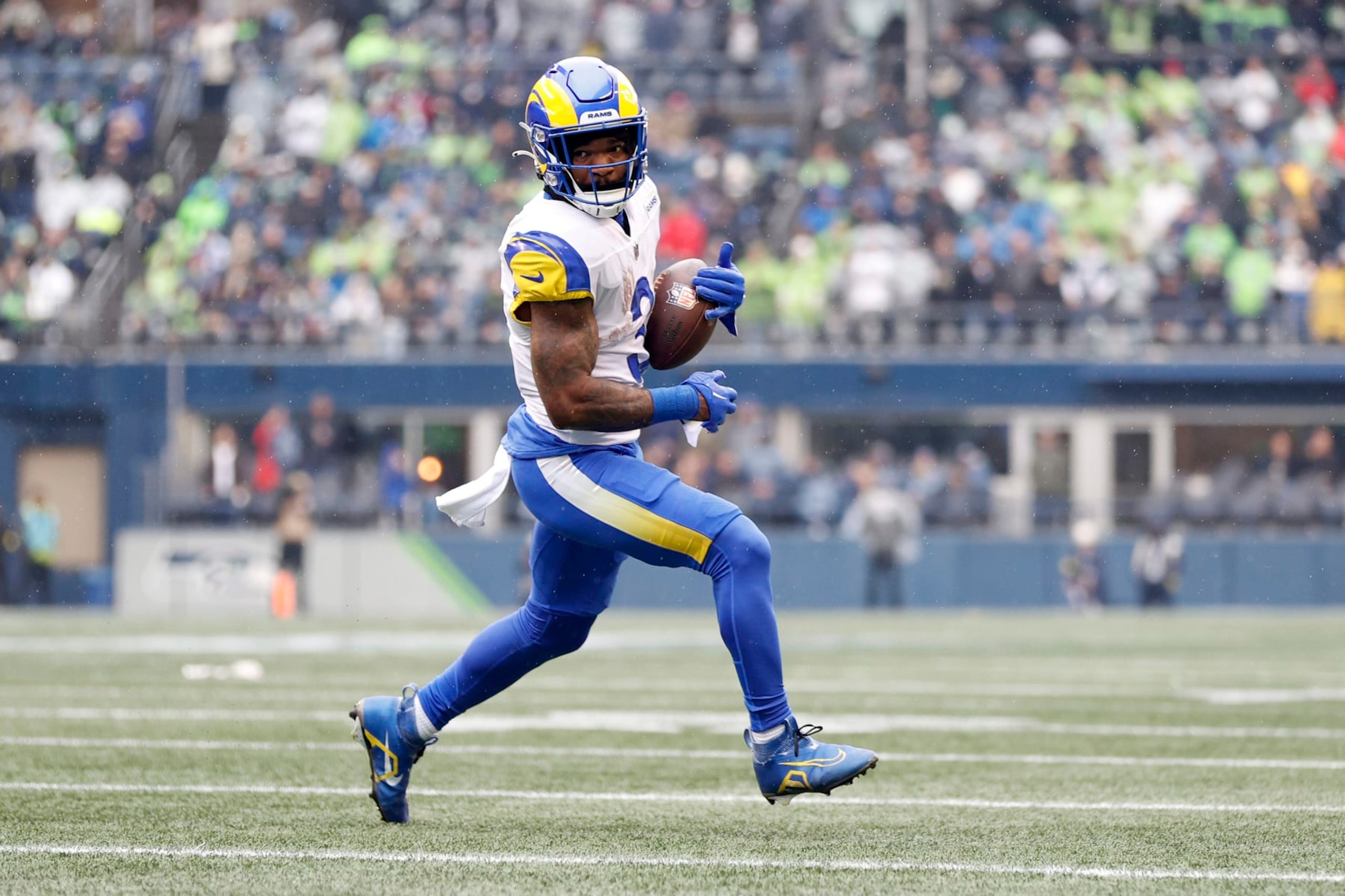 SEATTLE, WASHINGTON - JANUARY 08: Cam Akers #3 of the Los Angeles Rams carries the ball against the Seattle Seahawks during the first quarter at Lumen Field on January 08, 2023 in Seattle, Washington. (Photo by Steph Chambers/Getty Images)